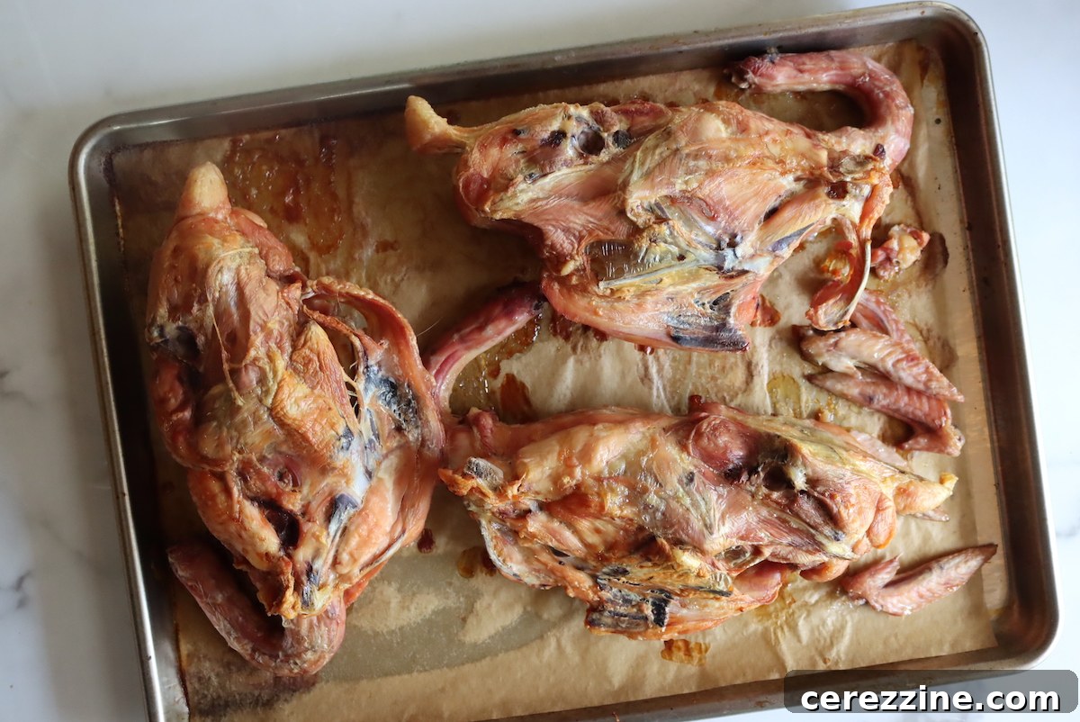 Roasted chicken carcasses and wing tips for making broth