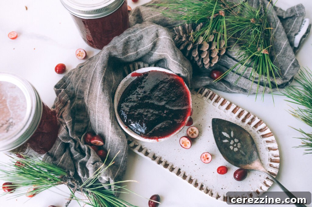 Over a Dozen Cranberry Canning Recipes 7 A jar of homemade cranberry jelly, showcasing its clear, ruby-red color