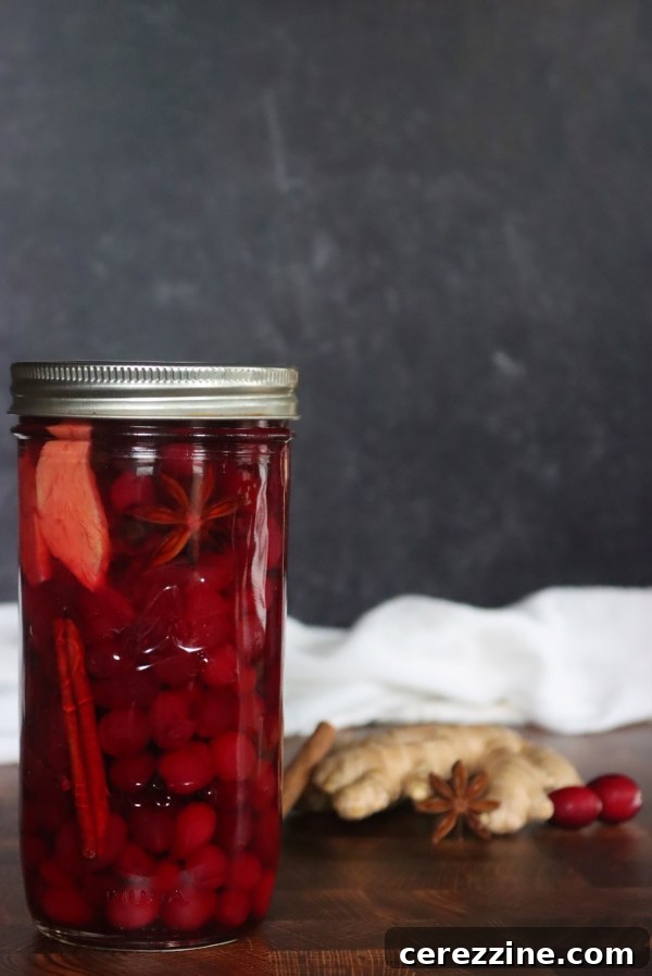 Pickled cranberries in sealed canning jars on a counter