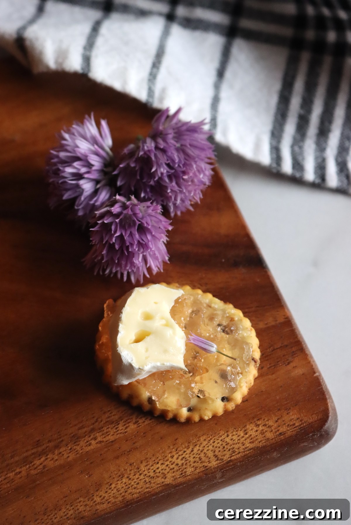 Serving Chive Blossom Jelly on a Cracker for Appetizers