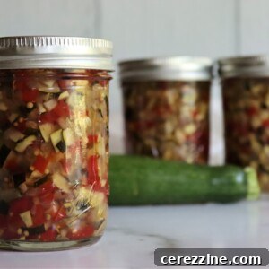 Zucchini Relish in a jar with a spoon