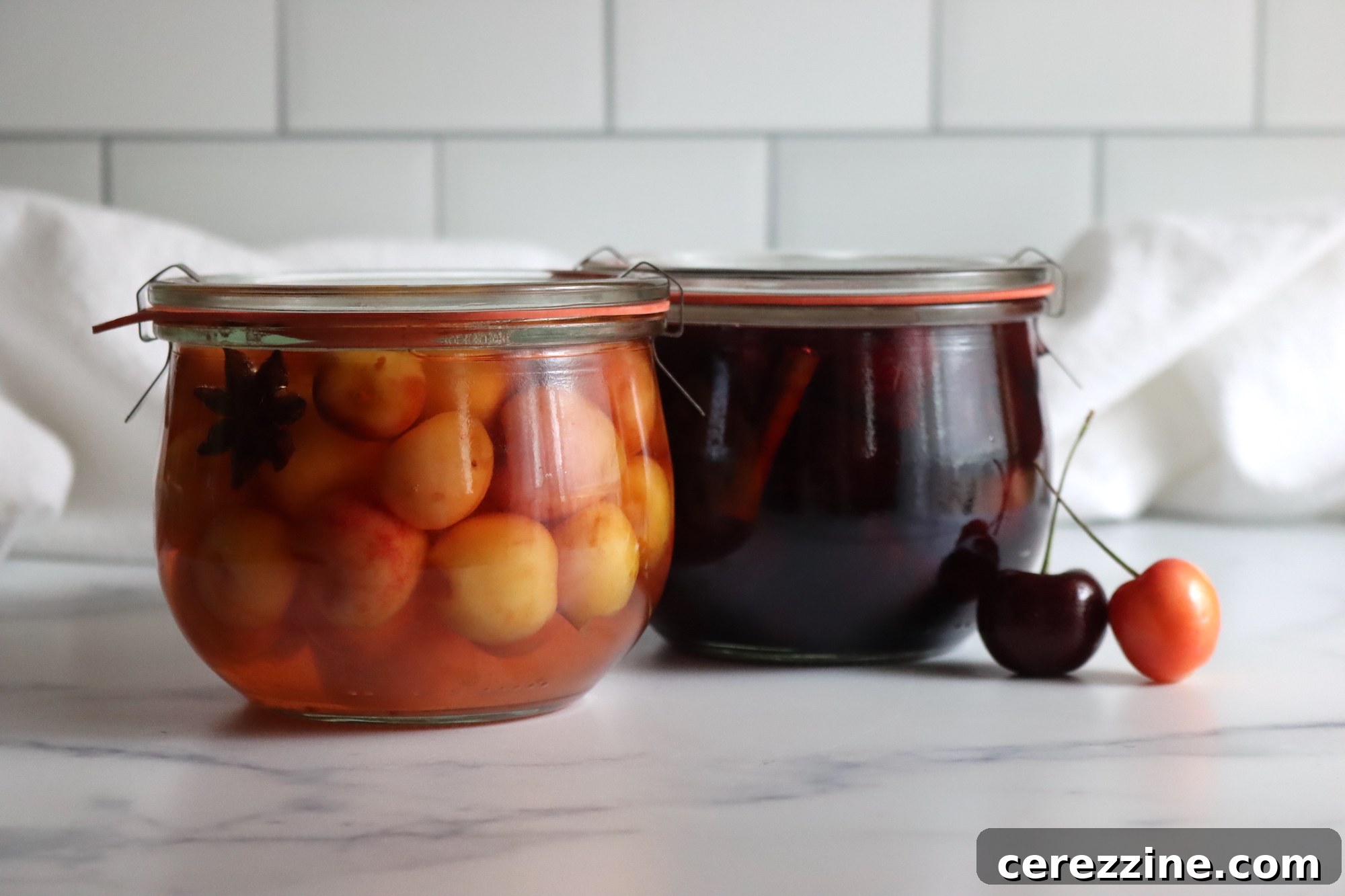 Fifty Varied Pickle Recipes From Asparagus To Zucchini 11 A jar of bright red pickled cherries with a sprig of herb, ready for serving or storage.