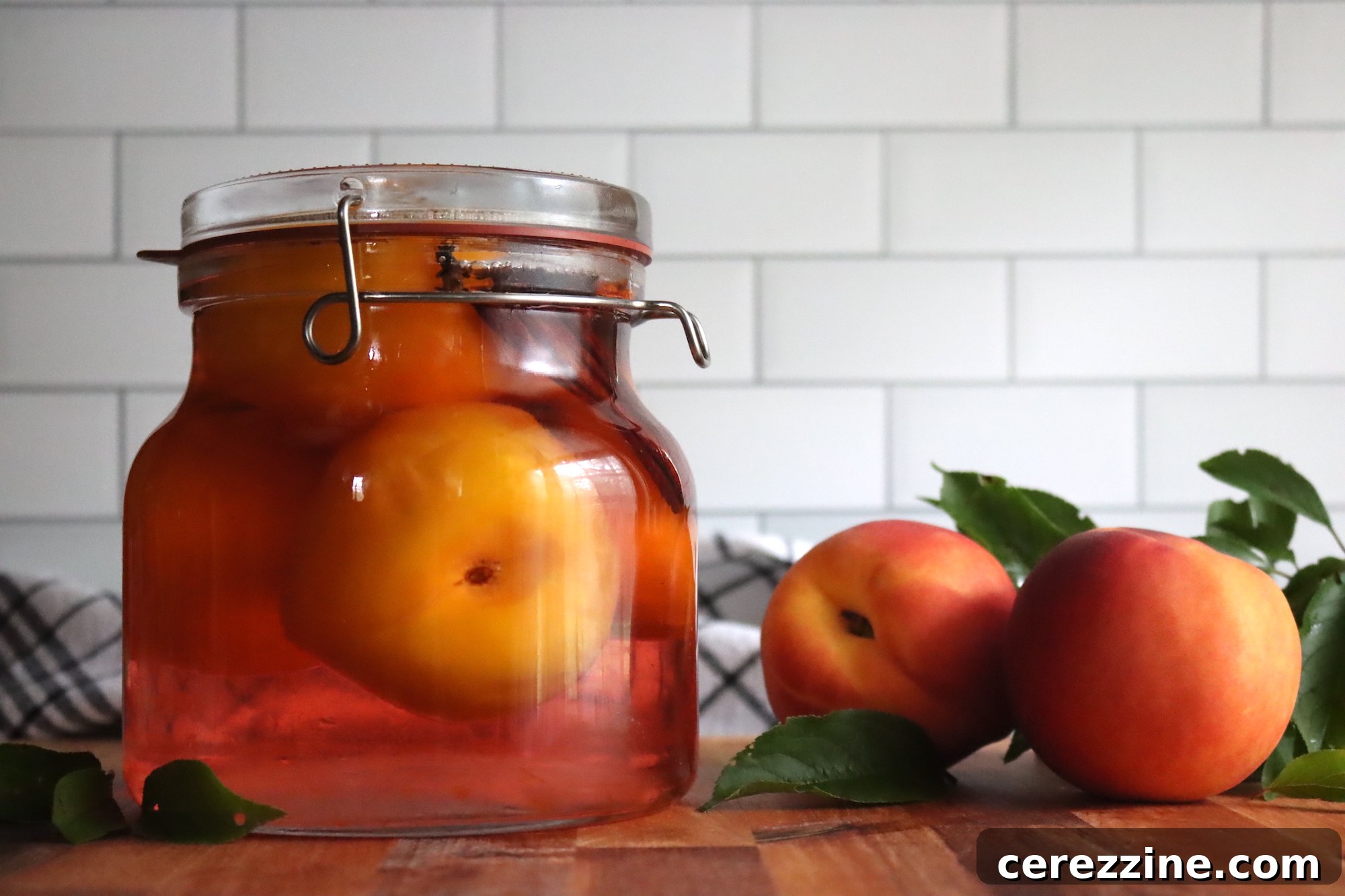 Fifty Varied Pickle Recipes From Asparagus To Zucchini 20 A glass jar filled with luscious pickled peaches and spices.