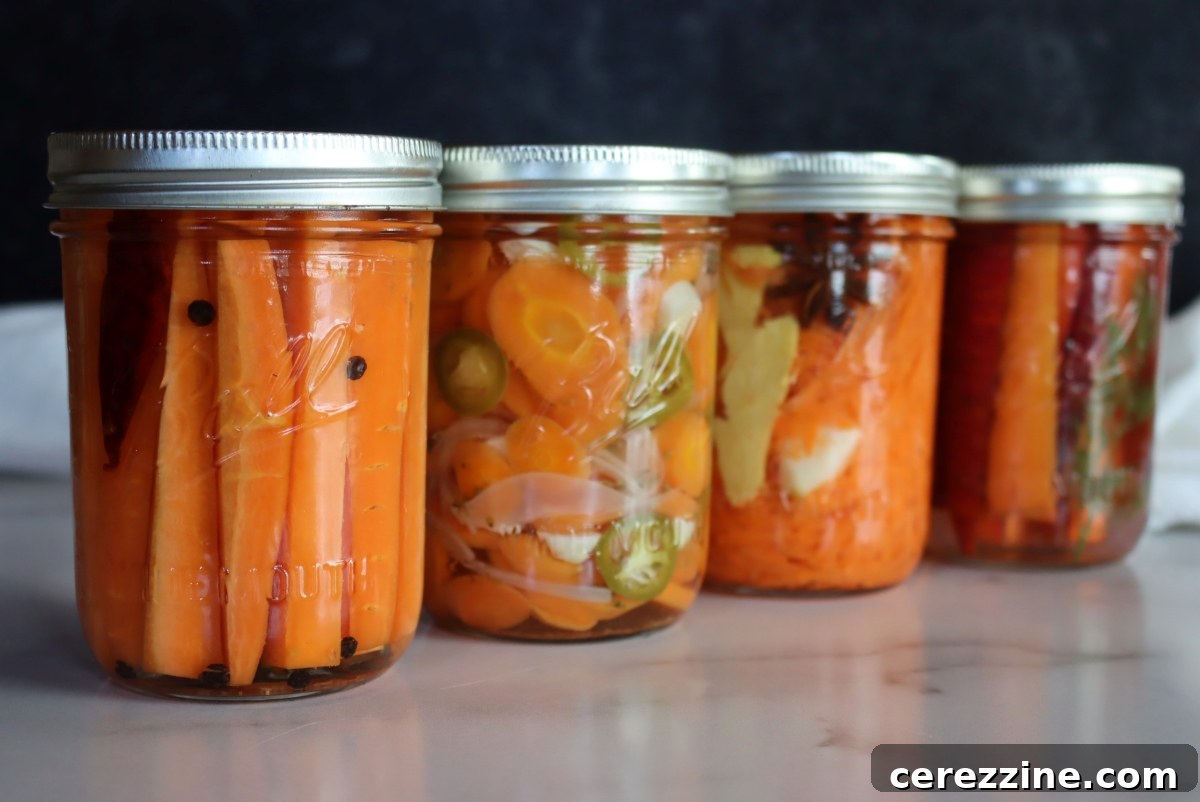 Fifty Varied Pickle Recipes From Asparagus To Zucchini 9 Glass jars filled with bright orange pickled carrot sticks.