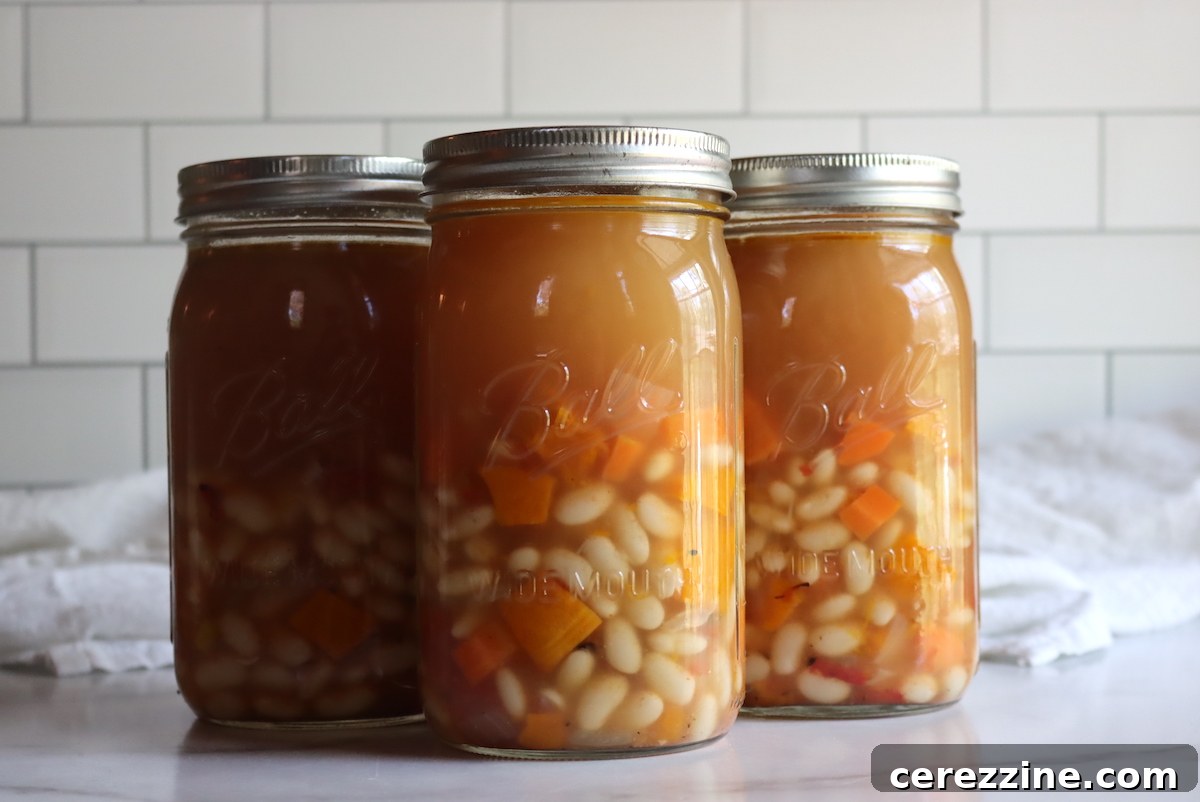 Winter Comfort: Canning Butternut Squash and White Bean Soup 4 Butternut Squash and White Bean Soup in a stockpot, simmering