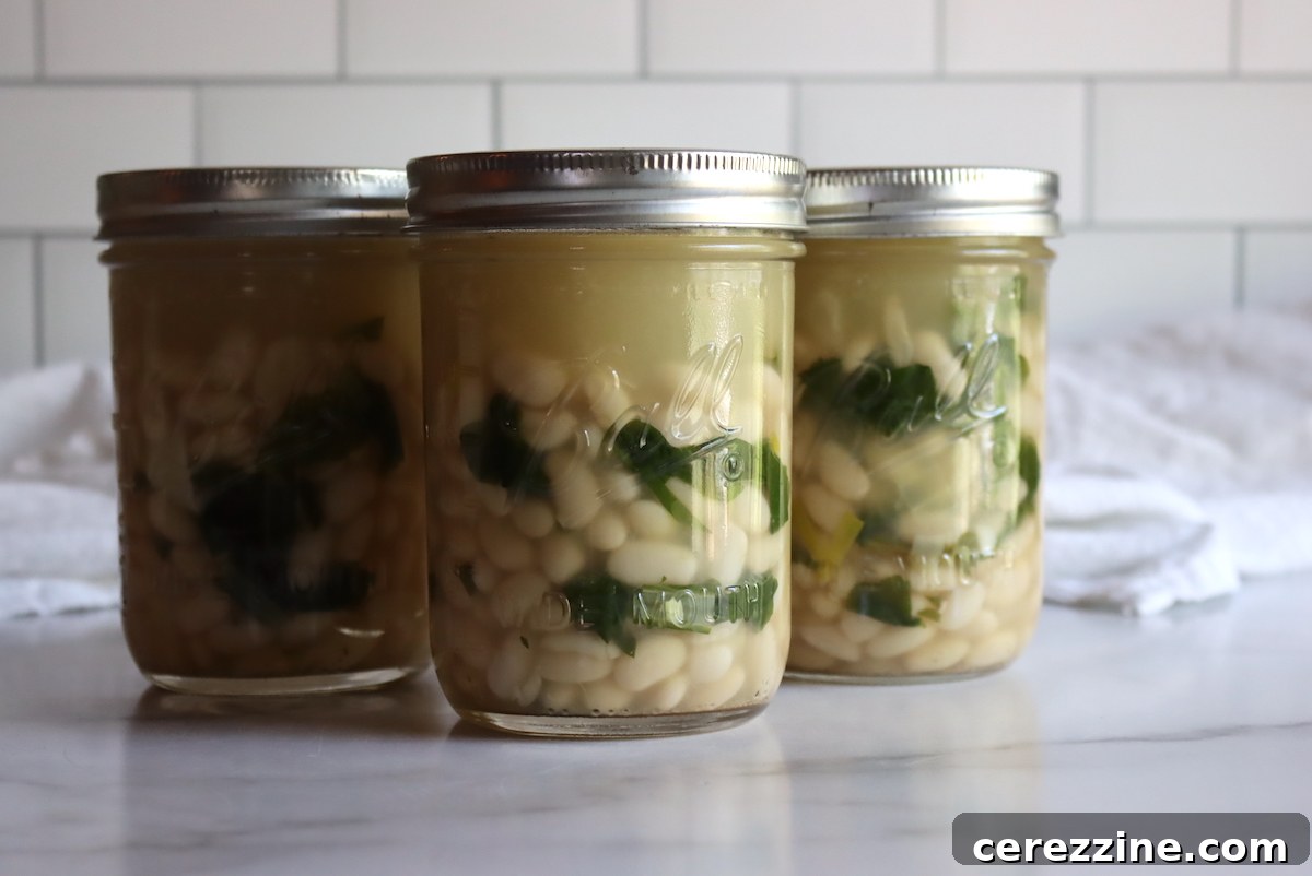Canning White Bean and Greens Soup - A full jar of homemade soup ready for the pantry.
