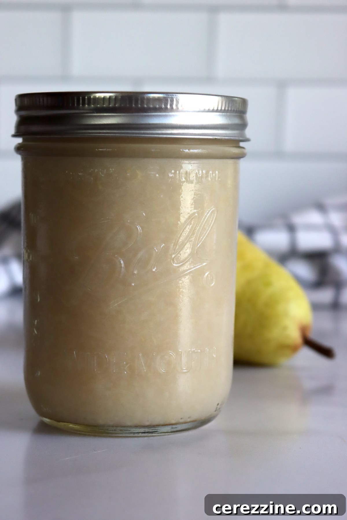 Freshly made pear sauce in a bowl, ready to be served or canned.