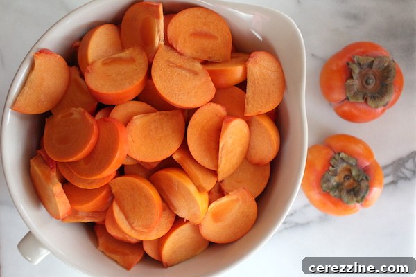 Homemade Fruit Butters: Apple, Pear, Peach and Beyond 9 Sliced persimmons on a cutting board.