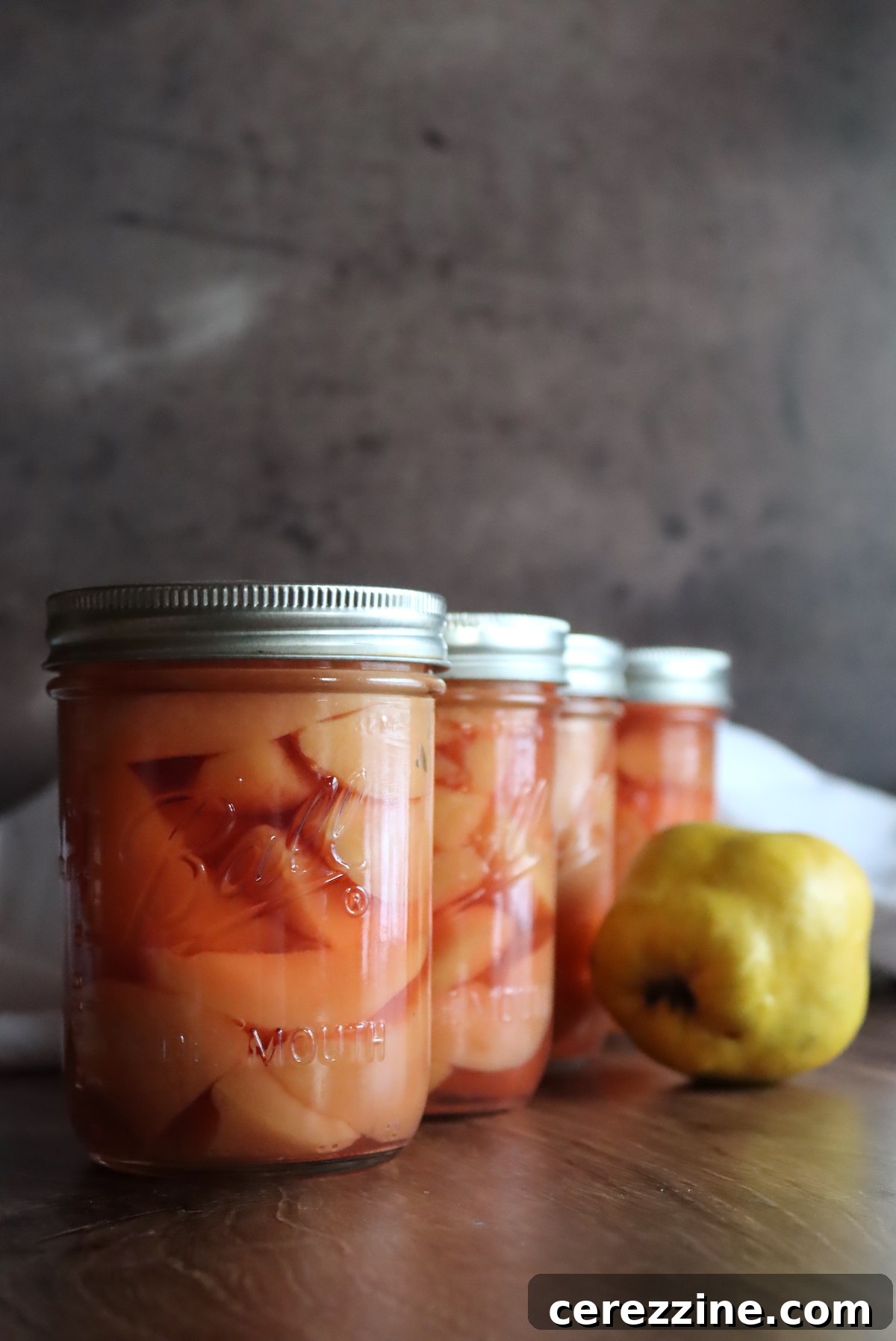 Canning Quince - Jars of canned quince on display