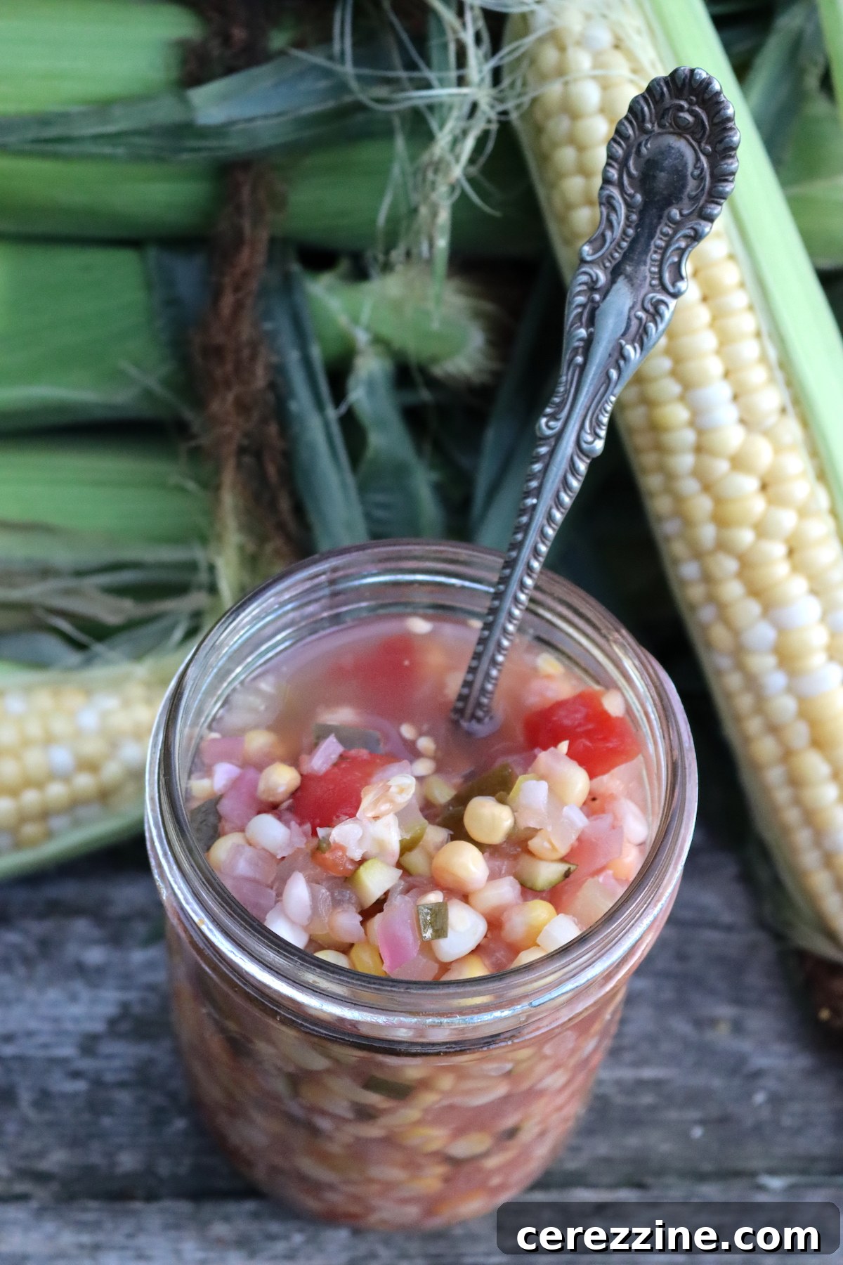 Preserve Summer: Homemade Corn Relish for Your Pantry 4 Bowl of freshly diced ingredients for corn relish, including corn, bell peppers, and onions.