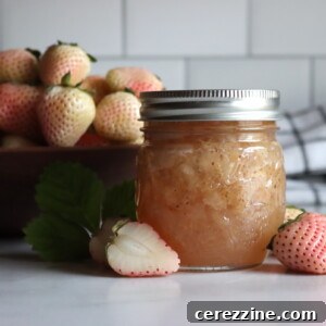 Pineberry Jam in a jar with fresh pineberries