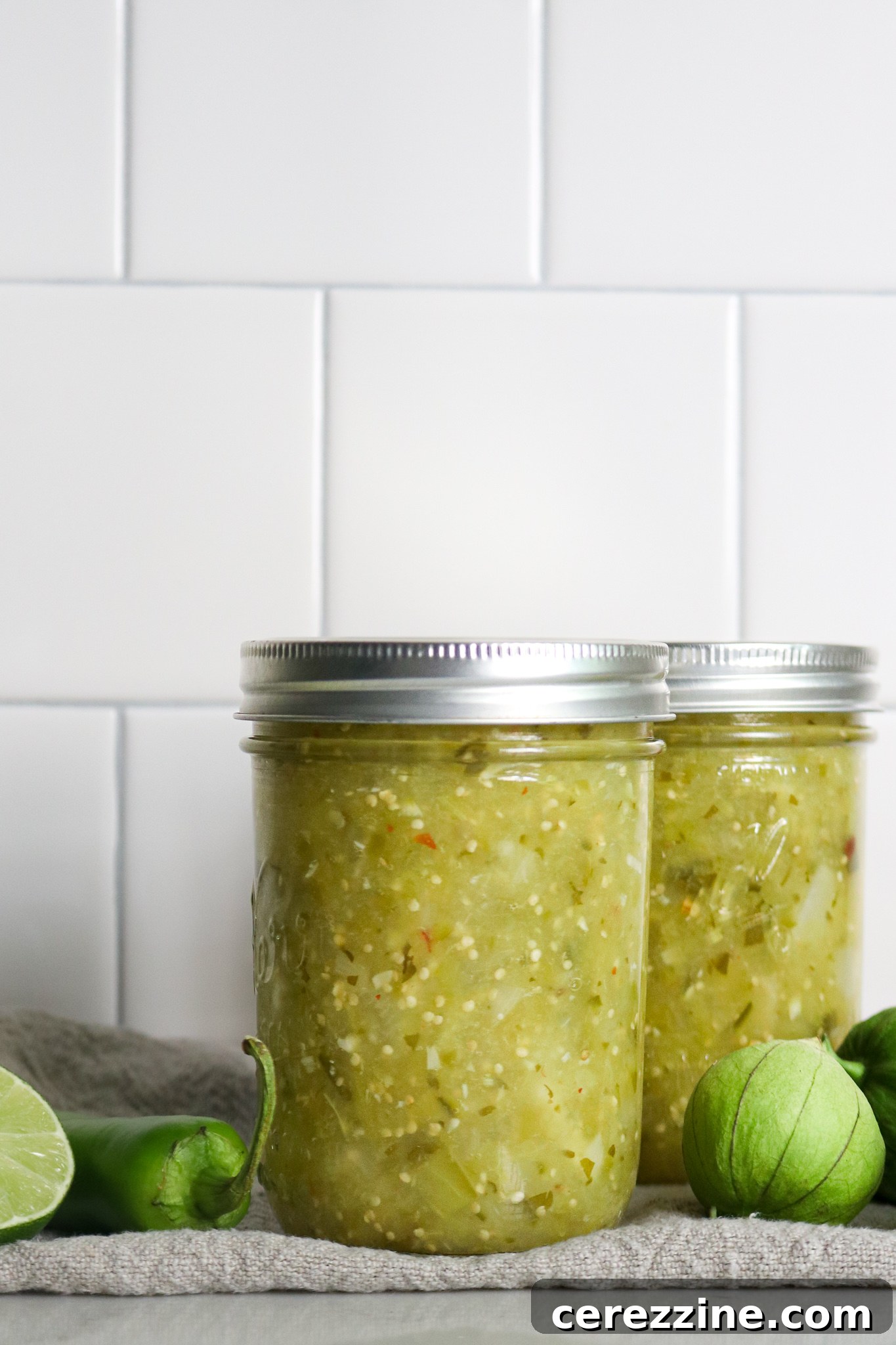 Finished Jars of Canning Tomatillo Salsa on a Shelf