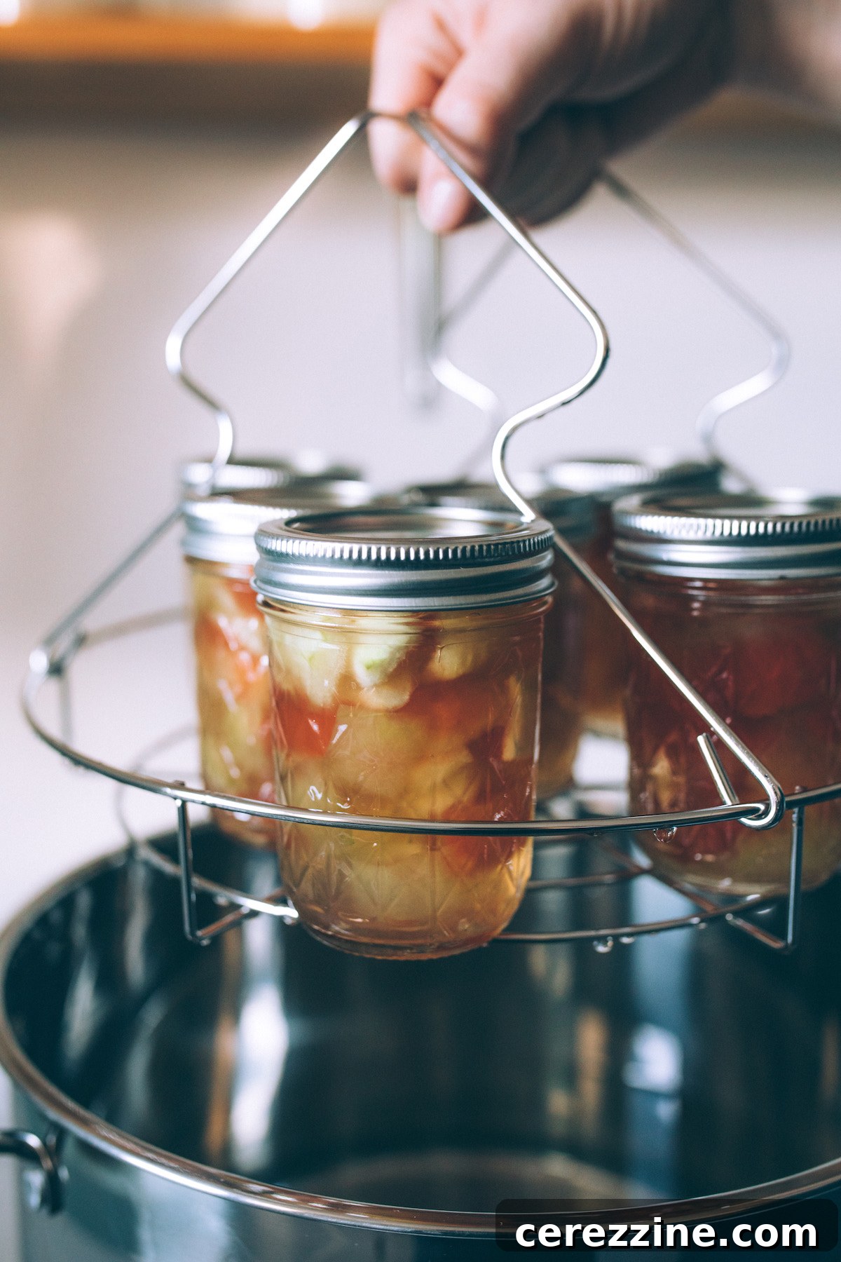 Karpuz Kabuğu Reçeli 16 Canned Watermelon Rind Preserves cooling on a towel-lined surface