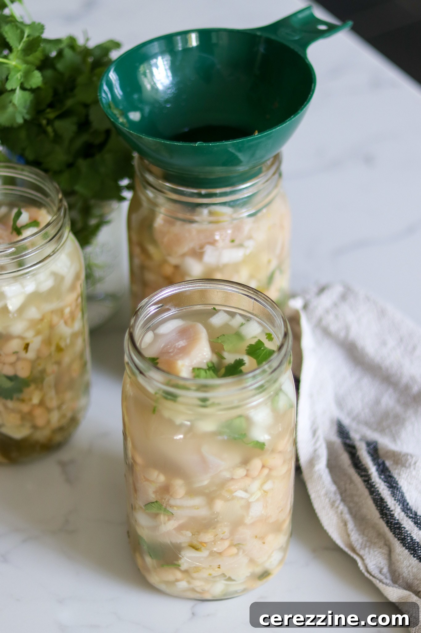Packing Chicken Chili Verde into Jars