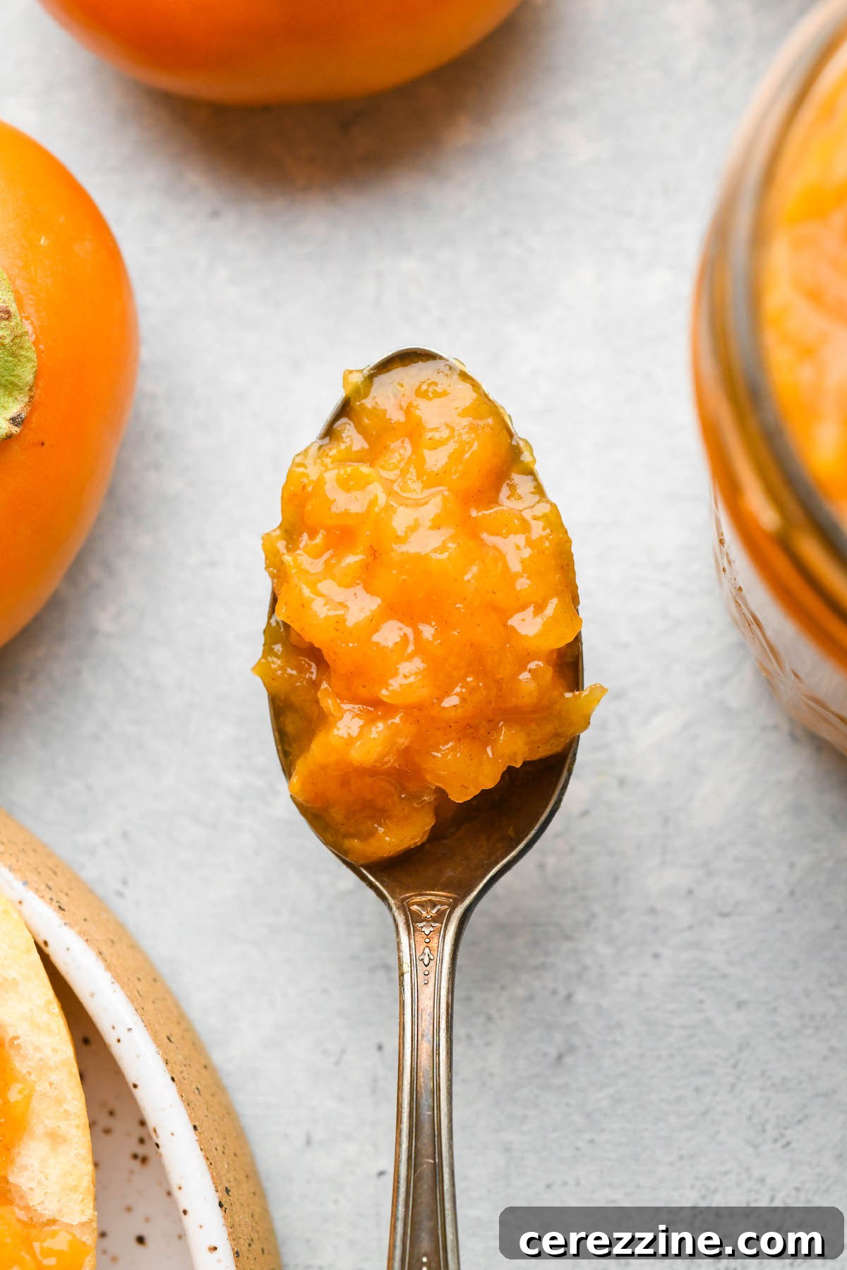 Perfectly set homemade persimmon jam, showcasing its natural pectin.