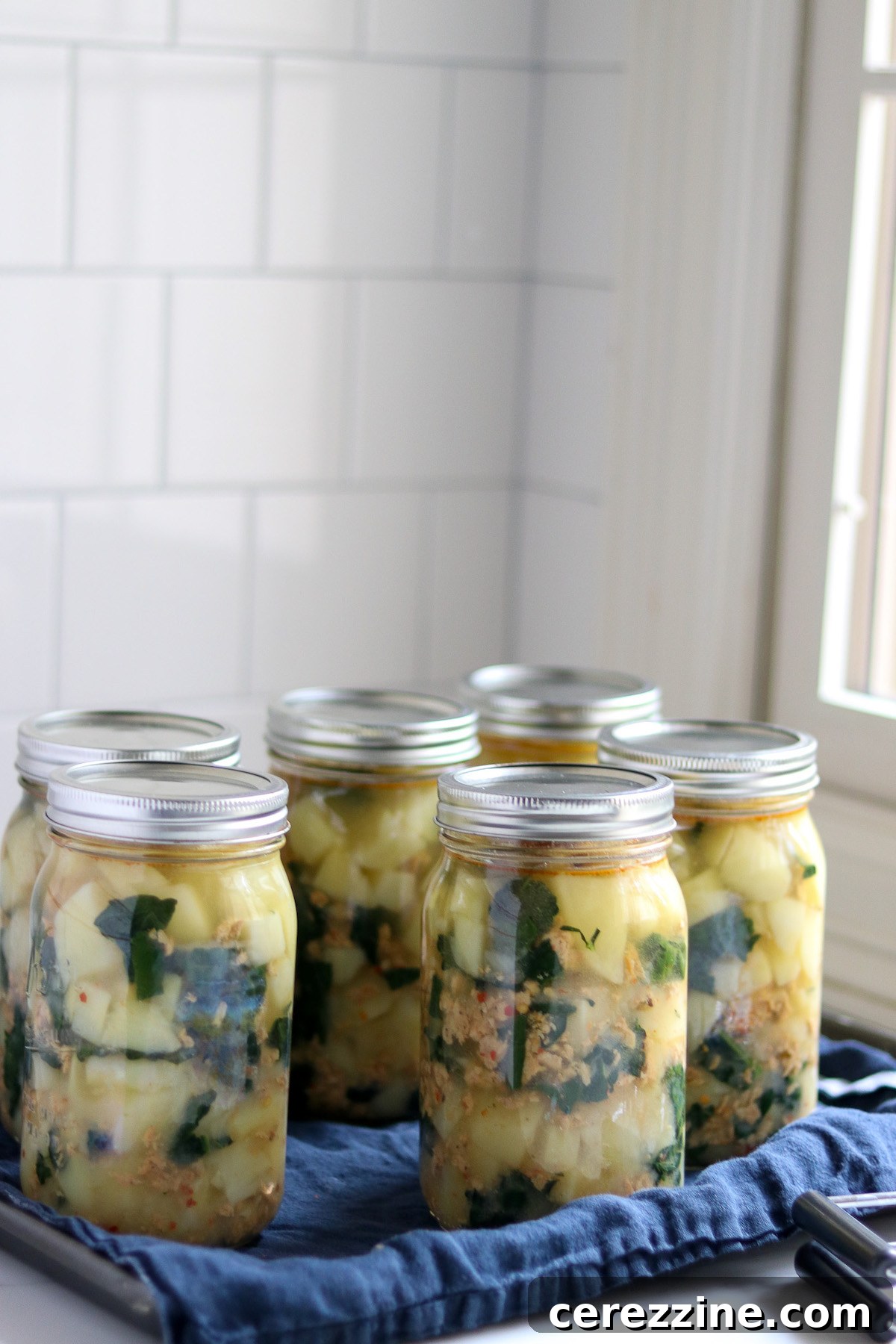 Canned Sausage Potato and Kale Soup ready for storage