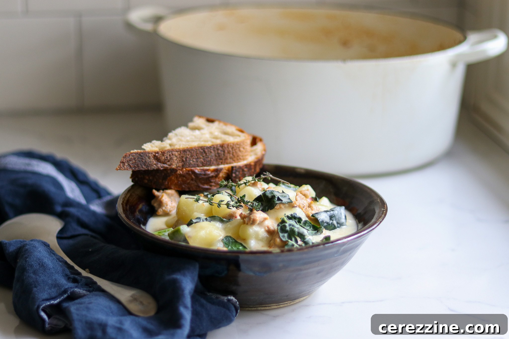 Serving homemade Zuppa Toscana soup with breadsticks