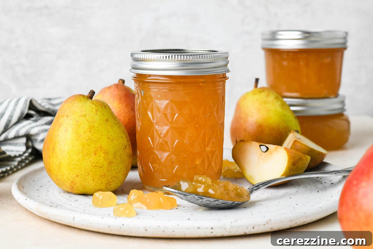 Sun Kissed Pear Jam 12 Jars of pear jam being removed from a water bath canner.