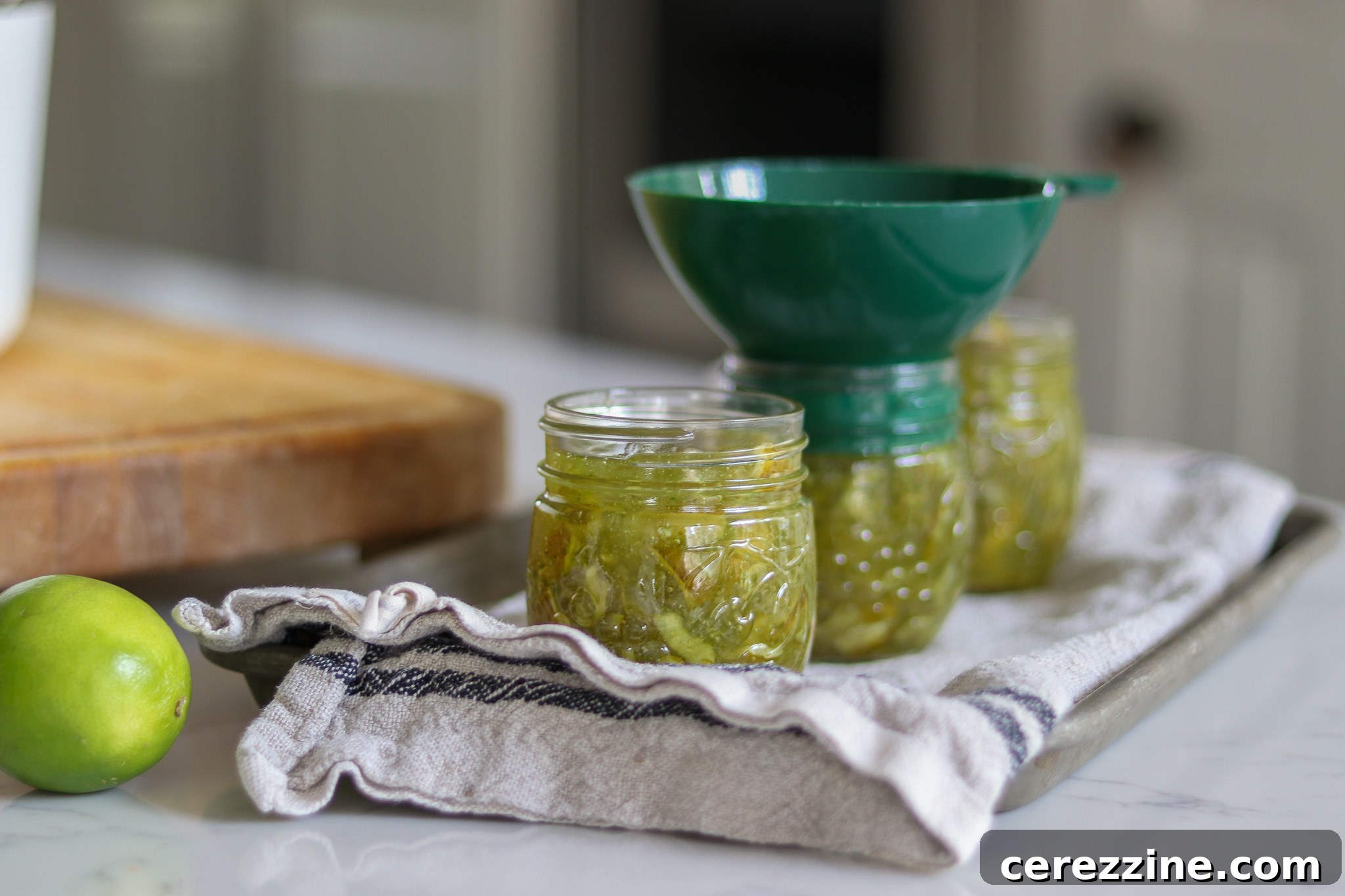 Jarring Lime Marmalade Filling Jars with Hot Lime Marmalade