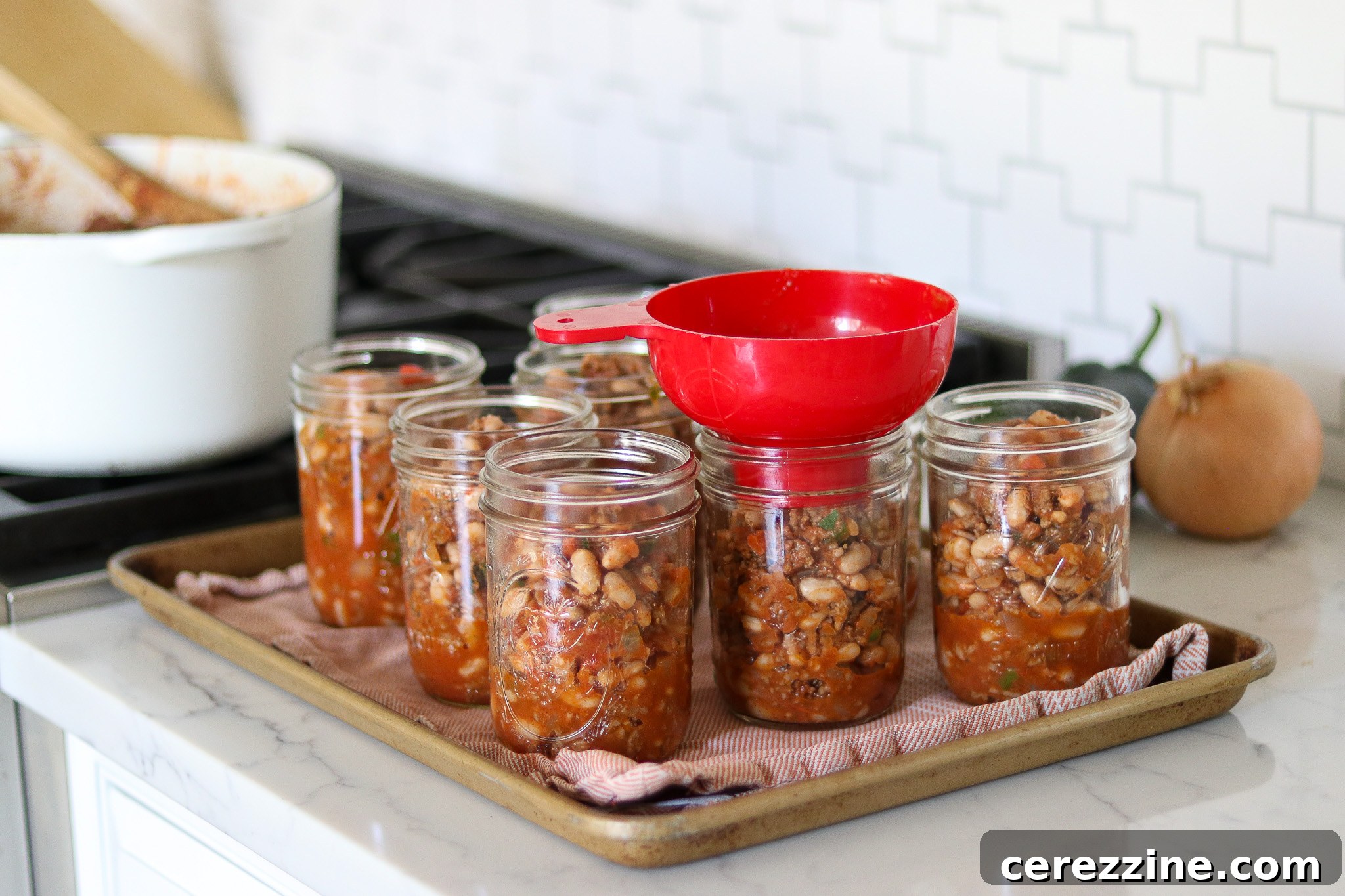 From Pot to Pantry: Canning Chili Con Carne 11 Filling Jars with chili for canning