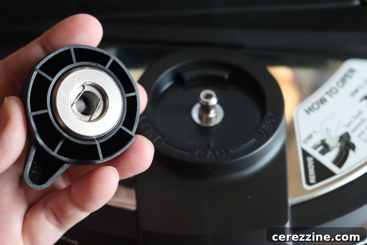 Close-up of the pressure regulator for an electric pressure canner, ready to be attached.