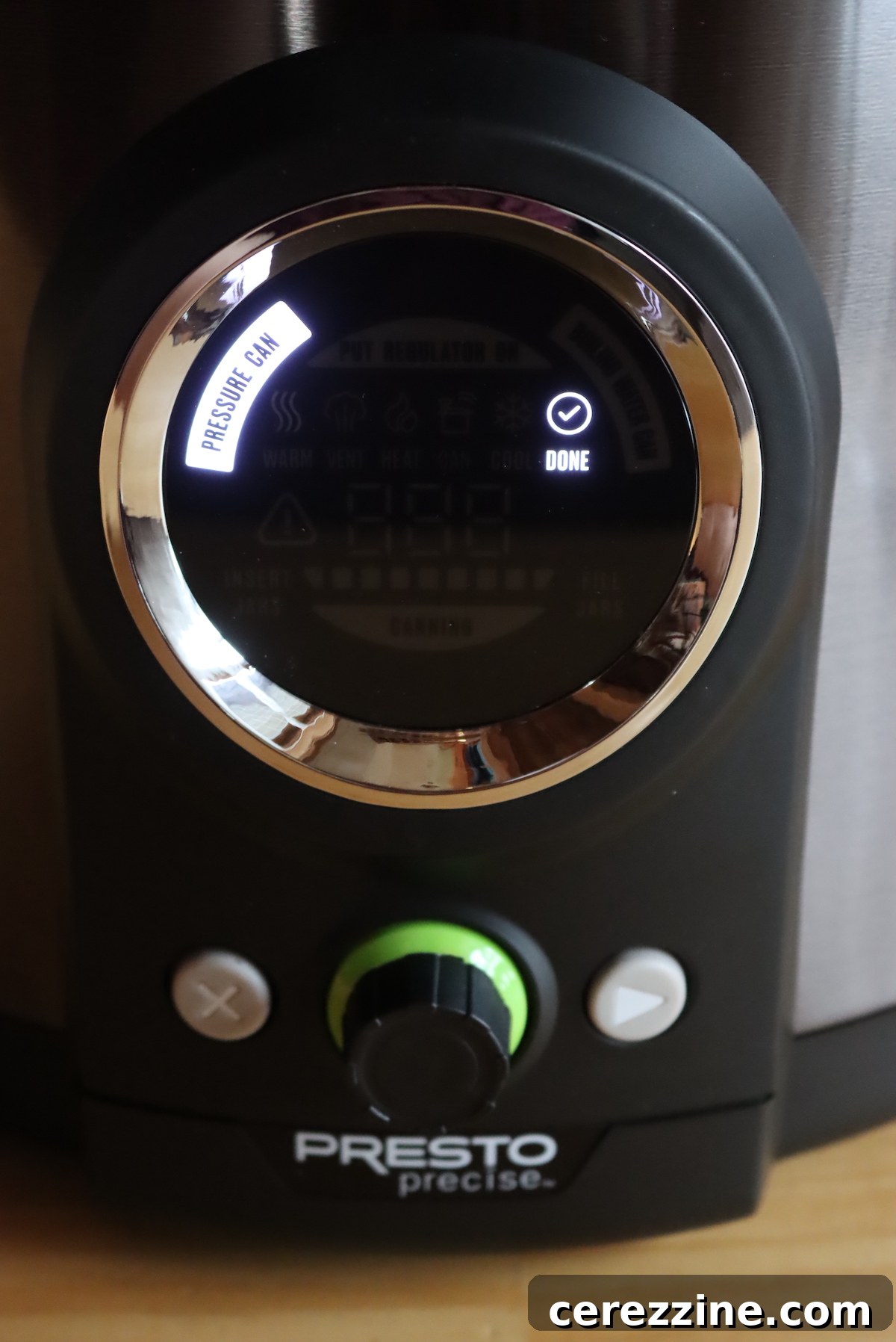 Digital pressure canner display showing 'Done' after the cooling cycle is complete.