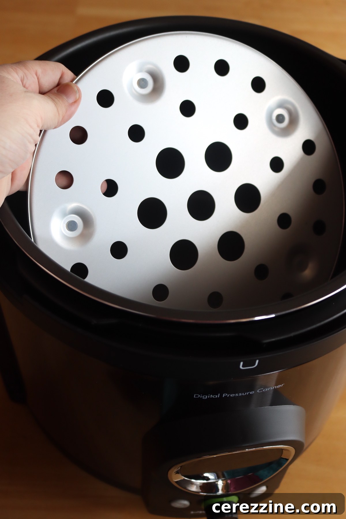 Inner pot and canning trivet correctly placed inside the Presto Precise Digital Pressure Canner.