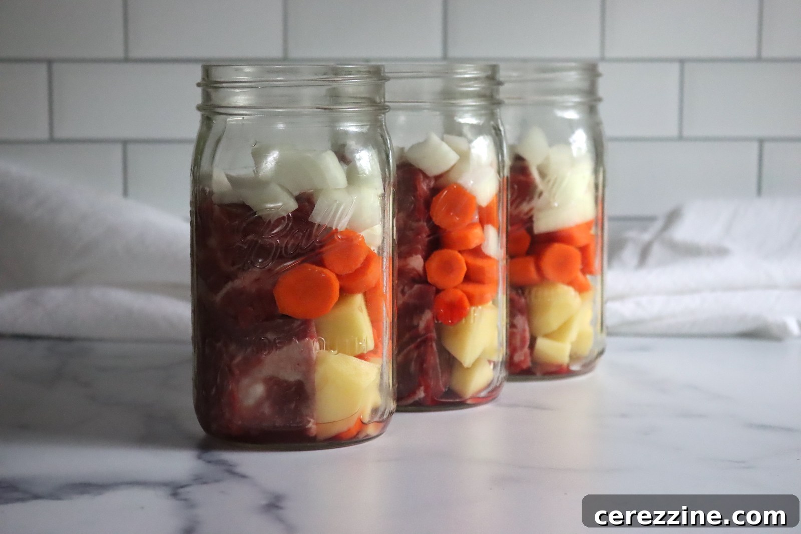 Pot Roast in Jars: A Canning Guide 4 Raw Pack Pot Roast ingredients carefully layered in a canning jar before processing