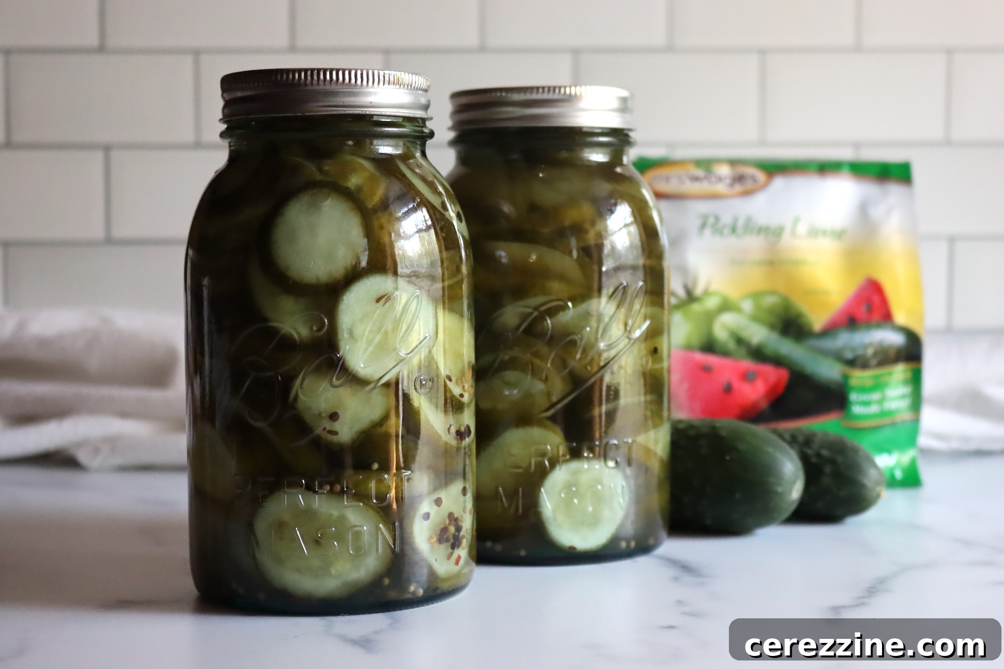 Old Fashioned Super Crispy Cucumber Pickles 2 Lime Pickle Cucumber - A close-up shot of perfectly sliced, crisp lime pickles in a jar, showcasing their vibrant color and firm texture.