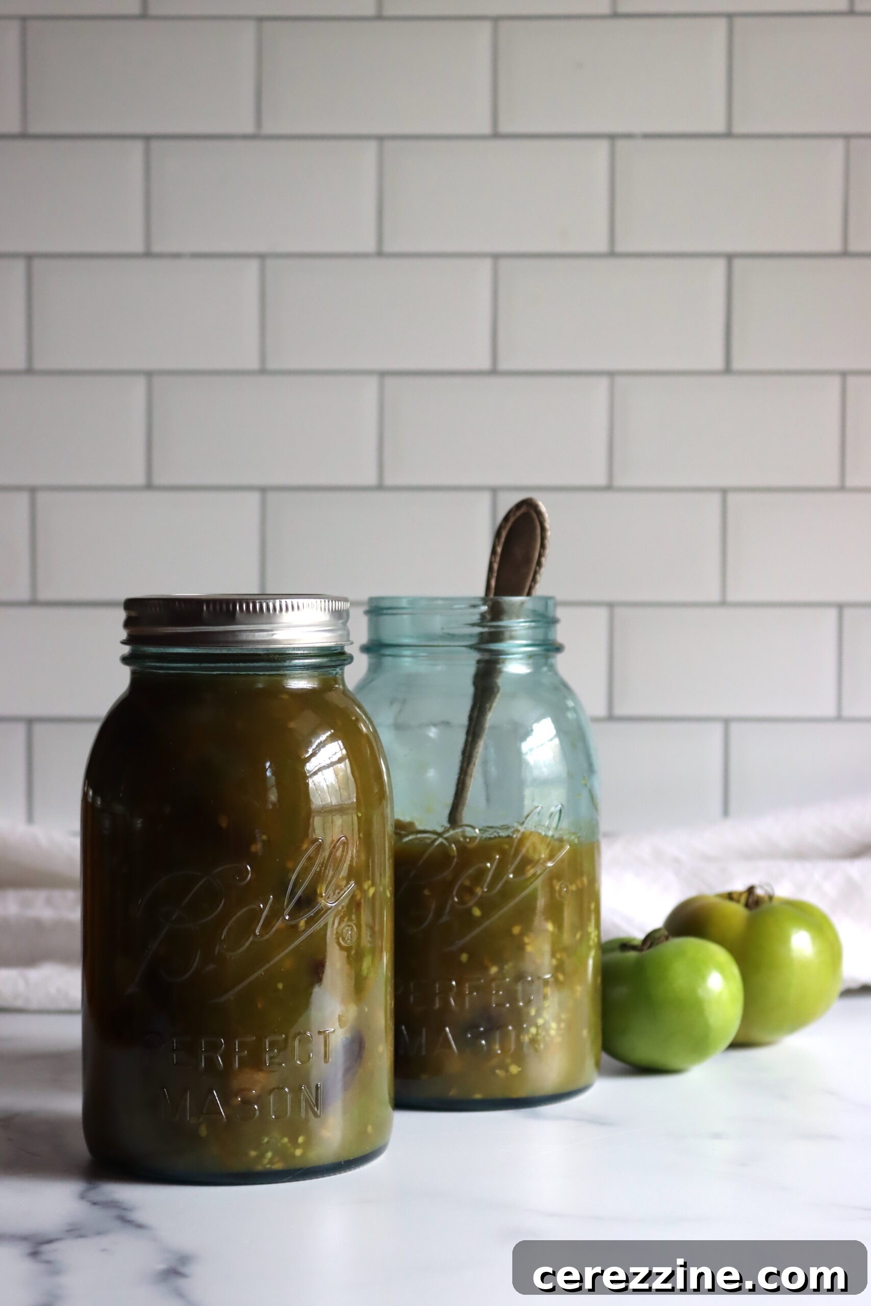 Green Tomato Pie Filling Canning - Beautiful blue tinted canning jars filled with pie filling.