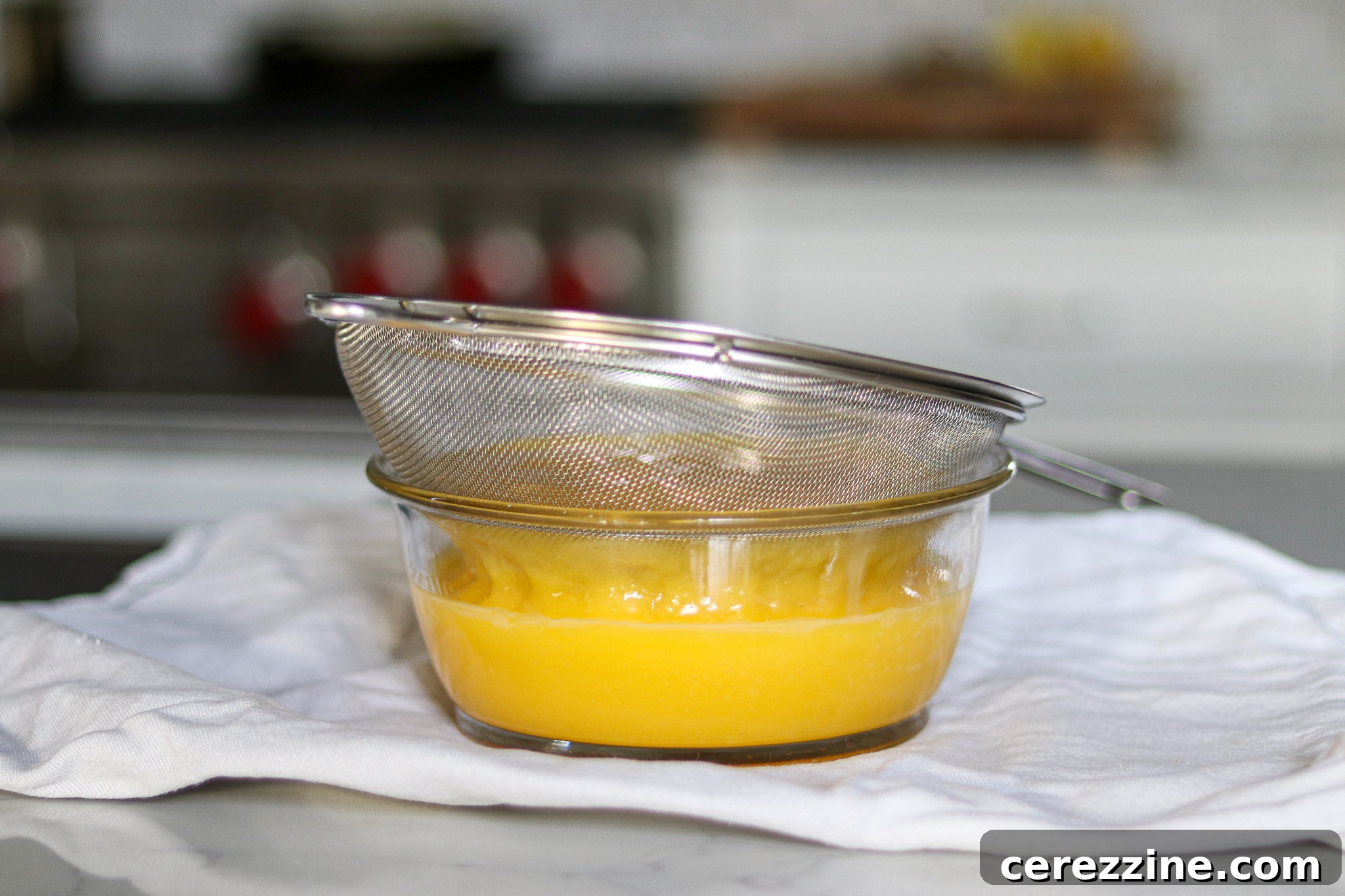Preserving Liquid Sunshine 17 Straining Lemon Curd