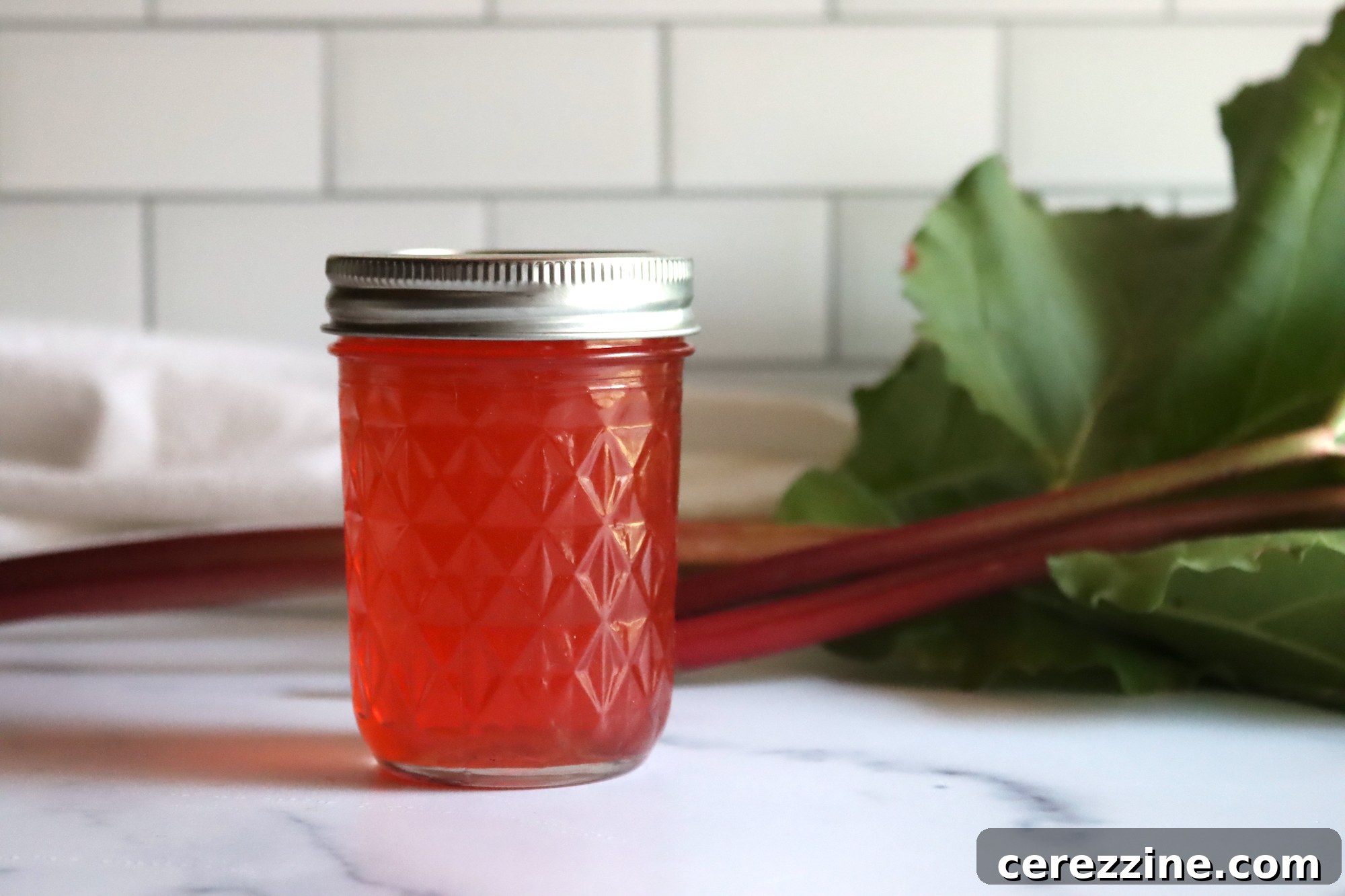 Ruby Rhubarb Jelly 5 A collection of jars filled with Rhubarb Jelly
