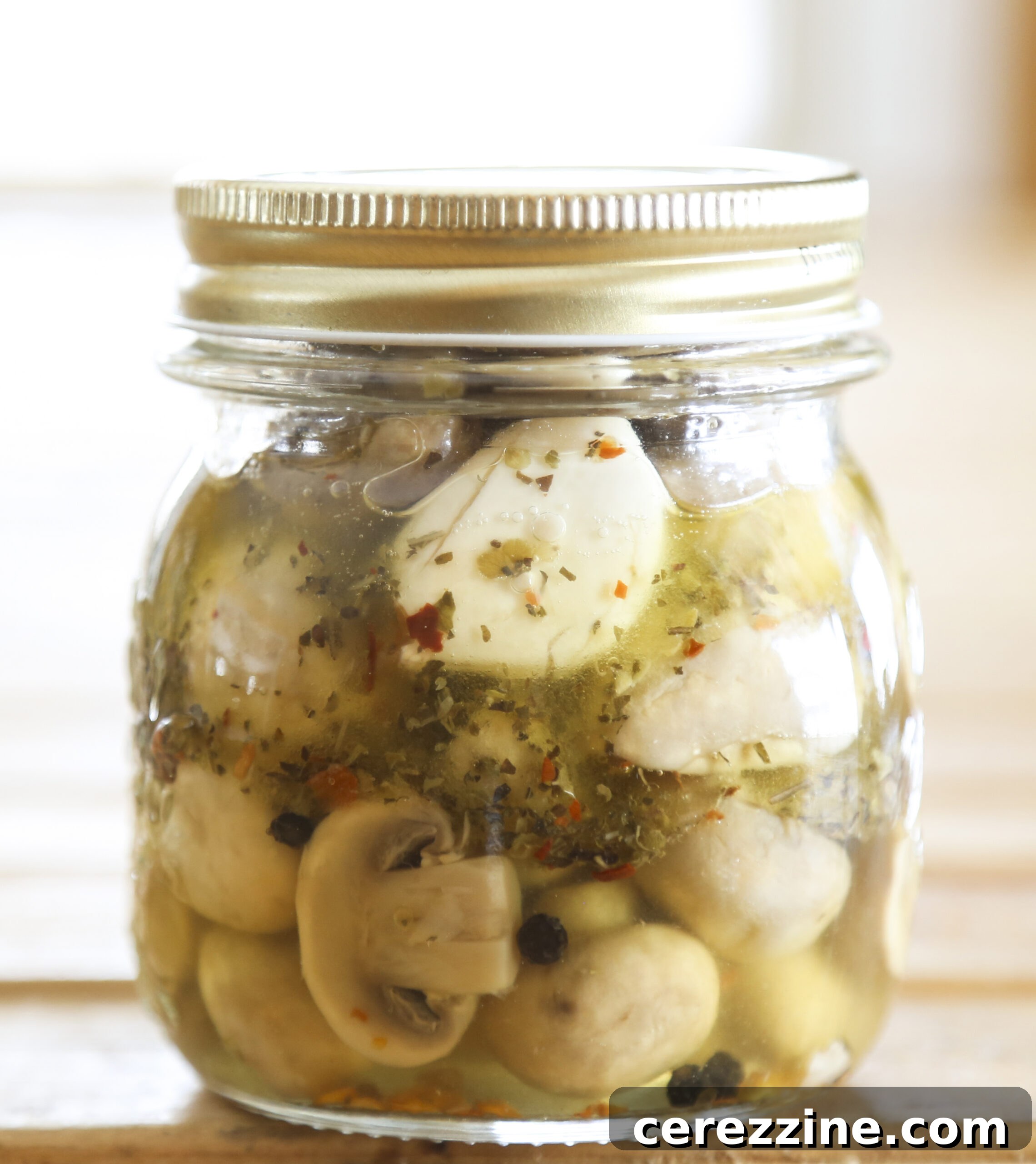 Close-up of freshly marinated mushrooms, ready for canning