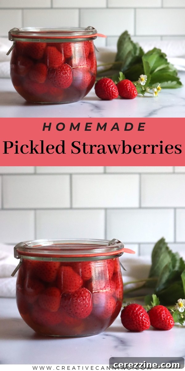 Homemade Pickled Strawberries displayed in elegant jars