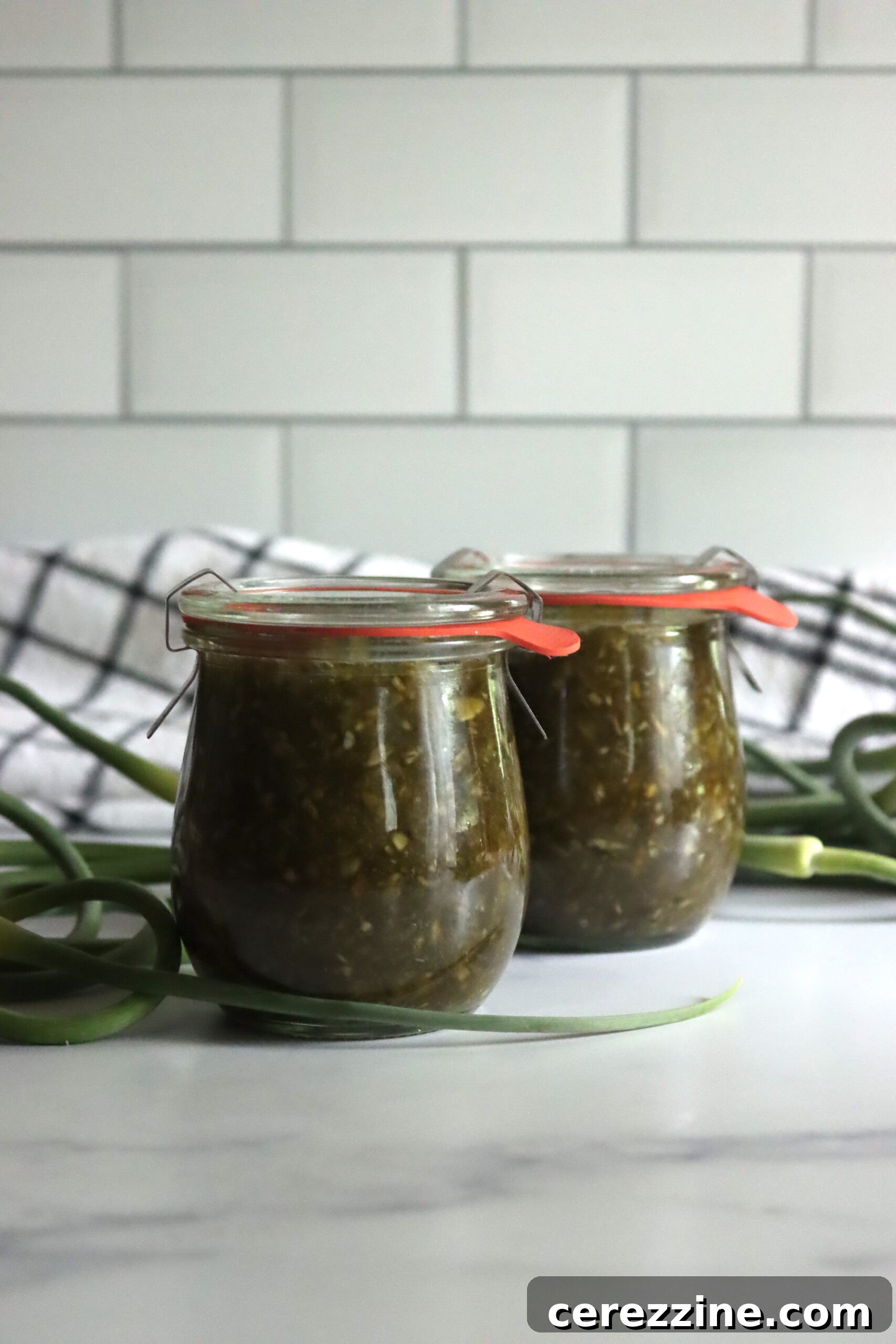 Pouring Garlic Scape Jam into Hot Jars