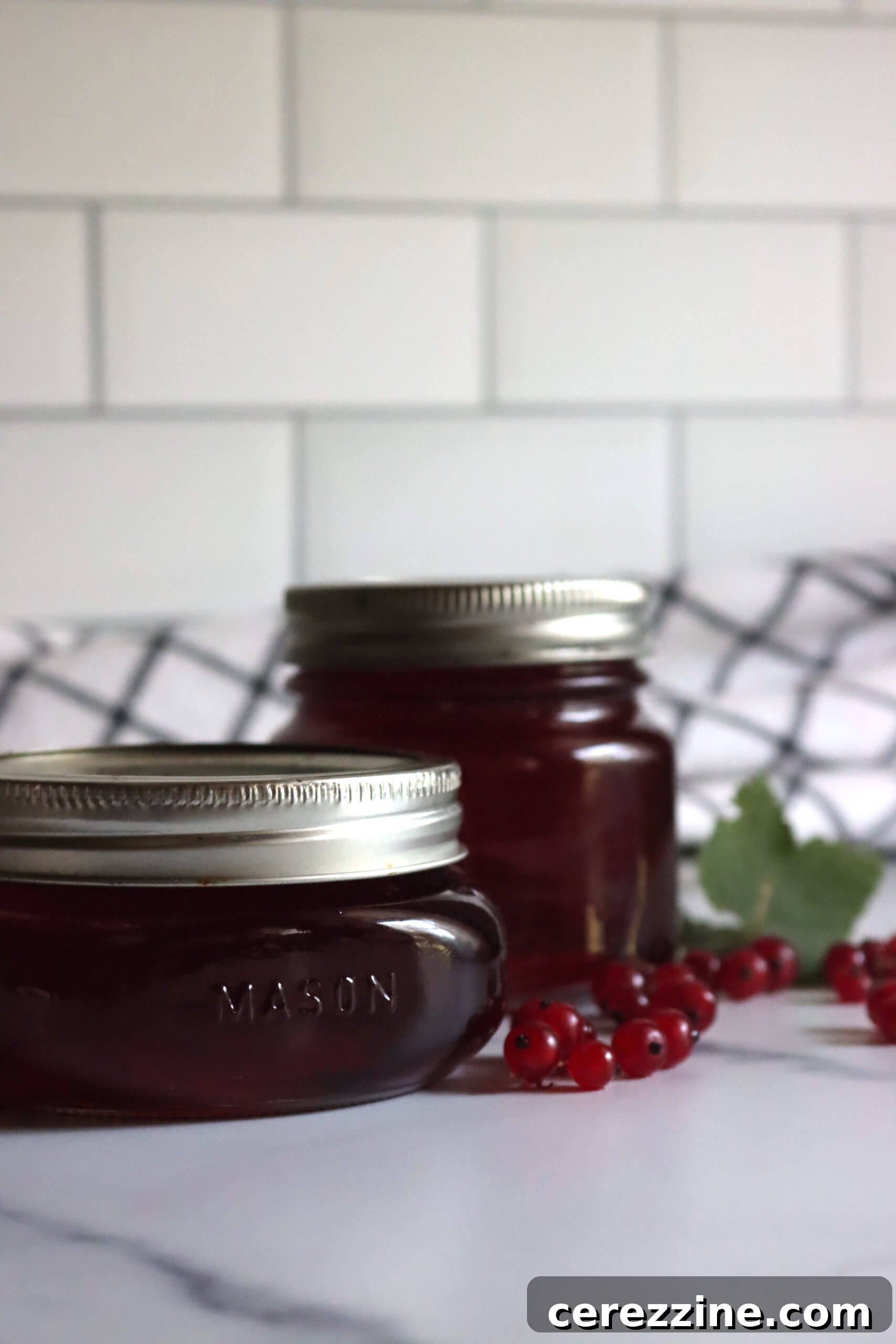 Red Currant Jelly simmering in a pot.