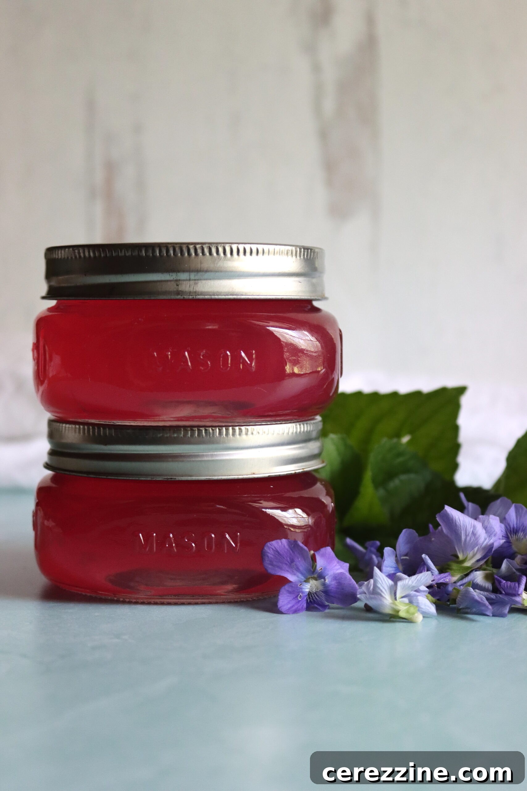 Jars of Violet Jelly on a Counter