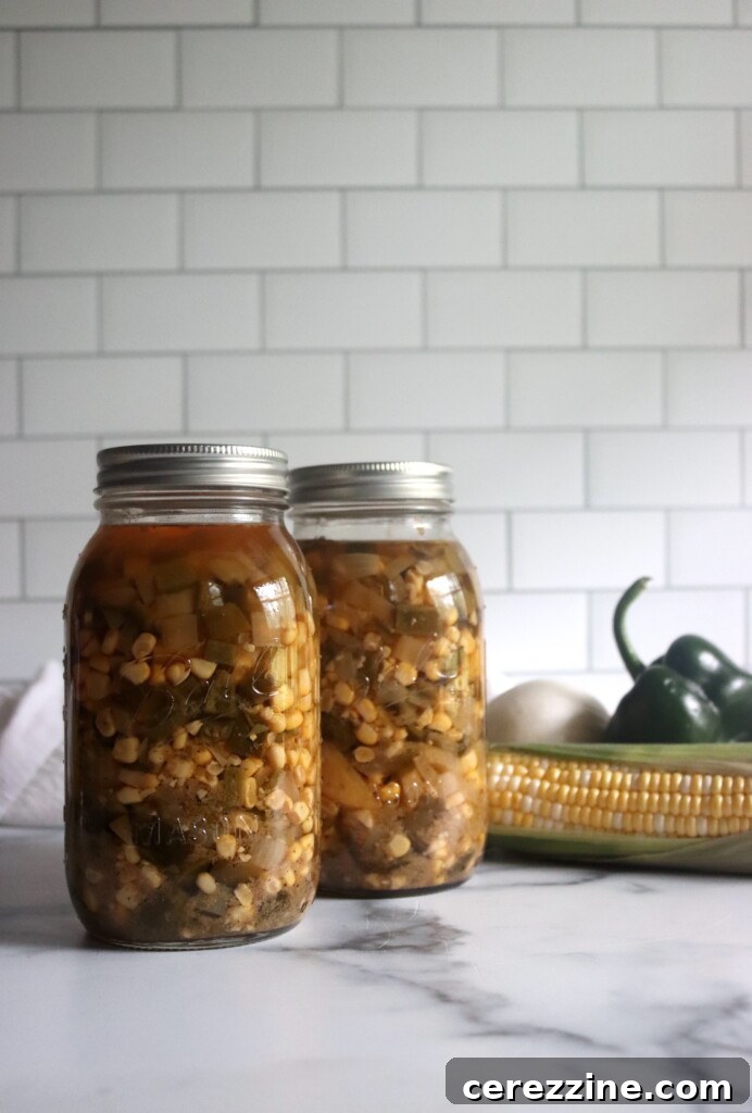 Two jars of homemade Poblano Corn Chowder ready for processing