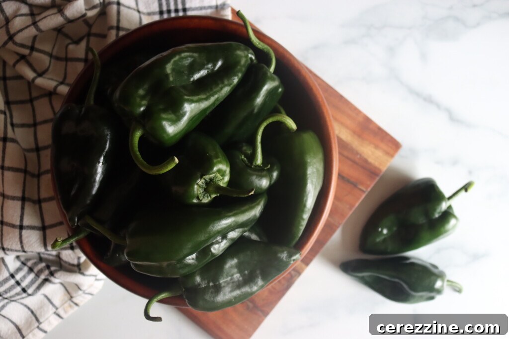 Close-up of fresh poblano peppers on a cutting board
