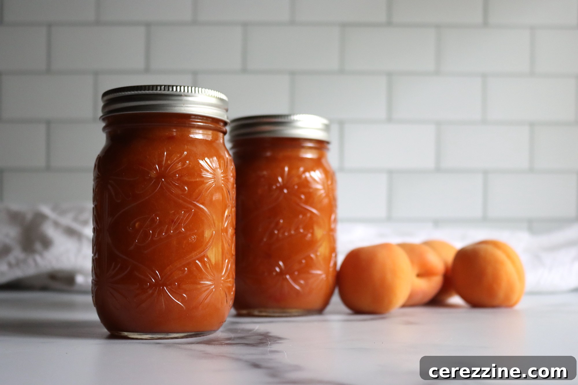 Apricot BBQ Sauce simmering in a pot, showing texture and color
