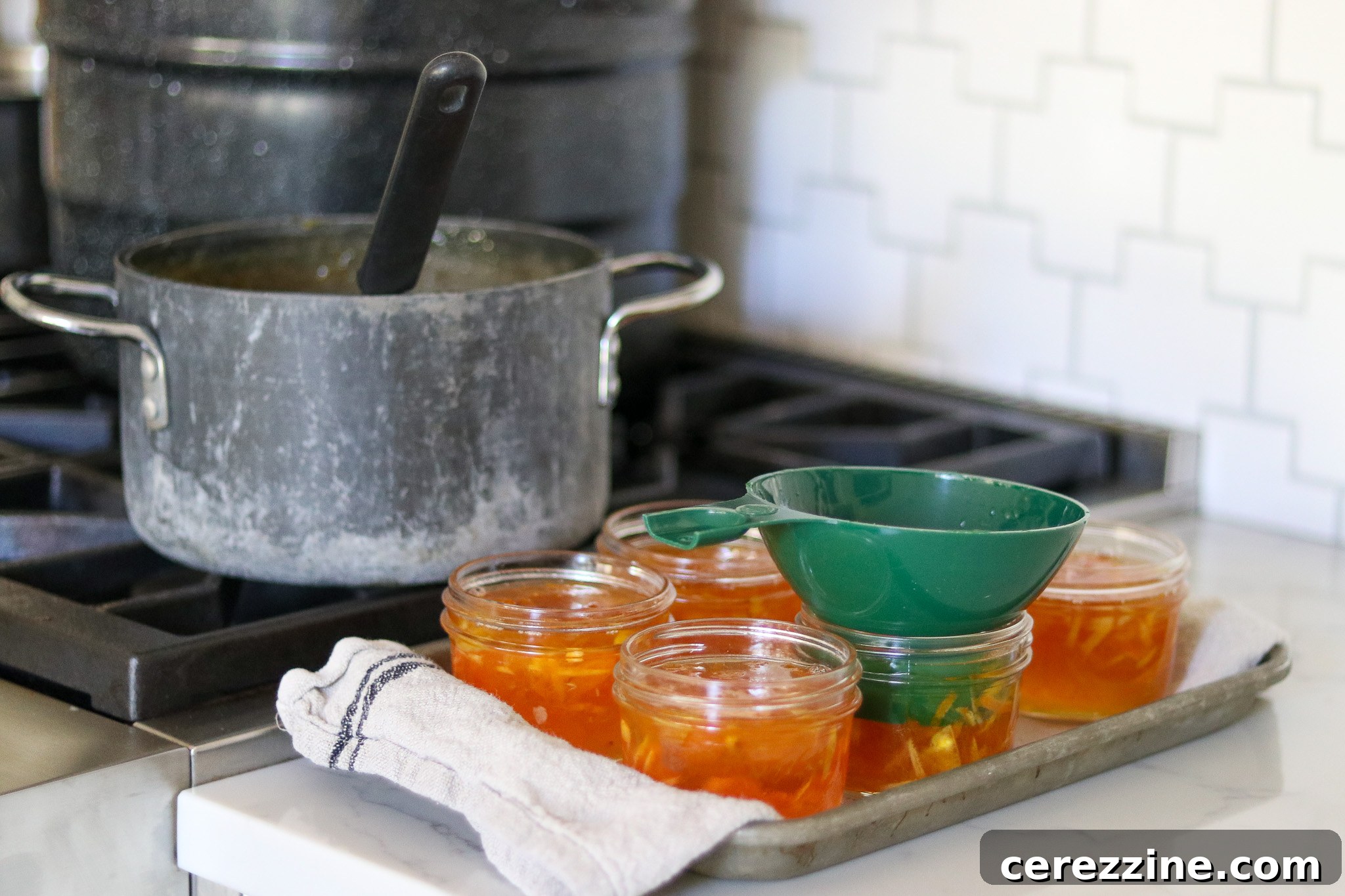 Ladle Kumquat Marmalade into Jars