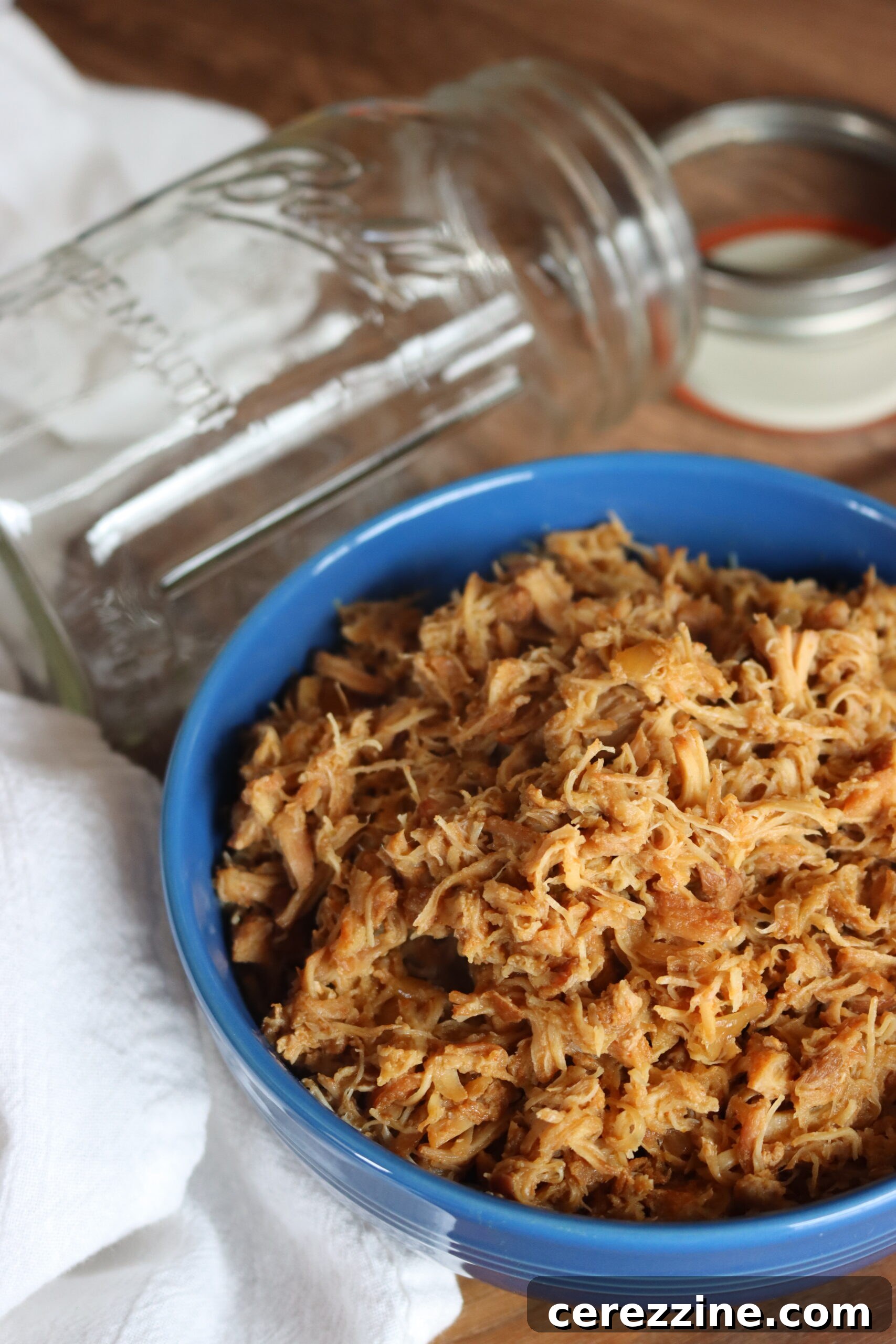 Homemade Canned Chicken Taco Meat 3 Close-up of shredded chicken taco meat, highlighting its texture and seasoning, ready to be enjoyed.