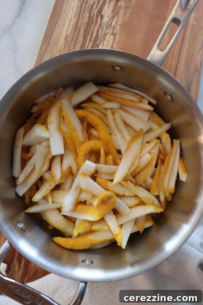 Sliced Buddha's Hand soaking in water in a pot.