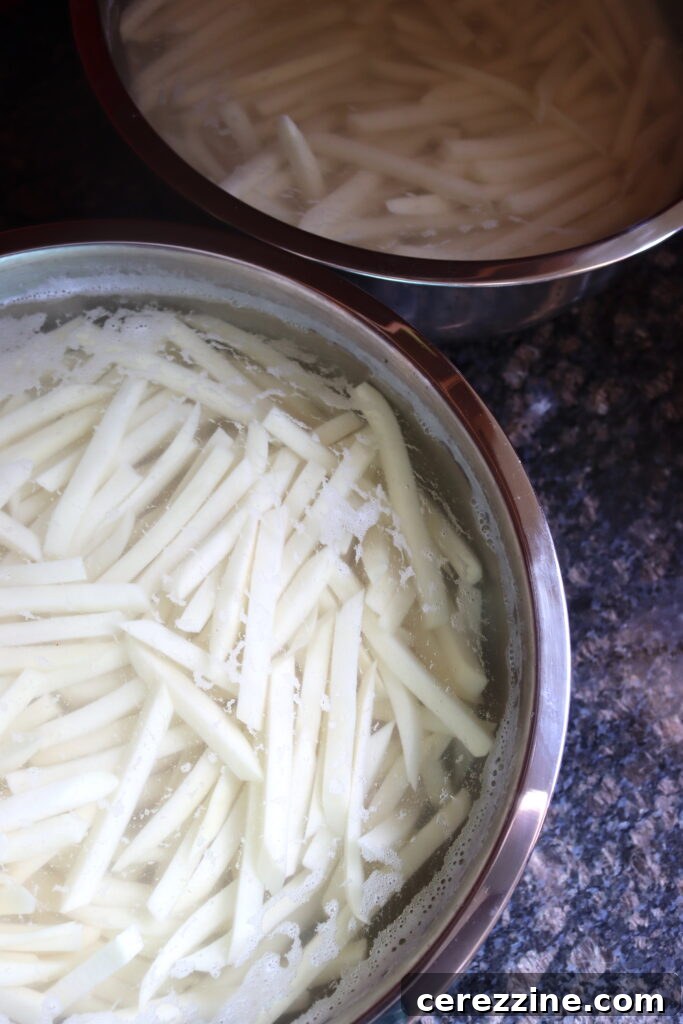 French fries soaking in water to remove starch