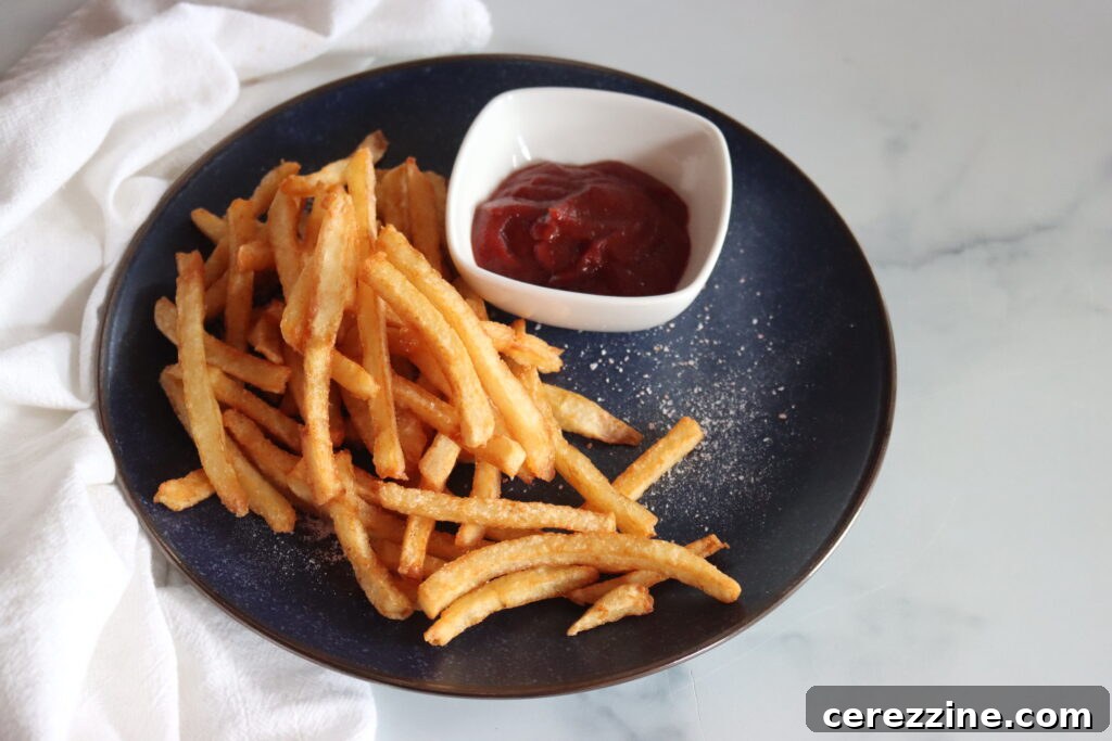 Raw French fries packed in a wide mouth jar
