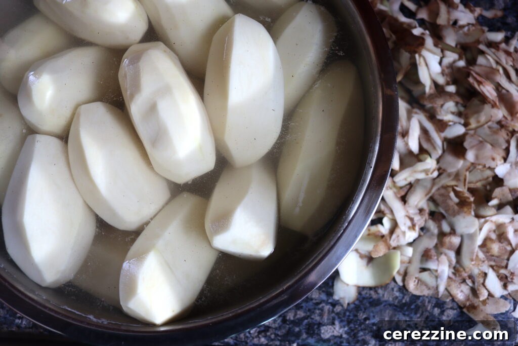 Peeled potatoes in water