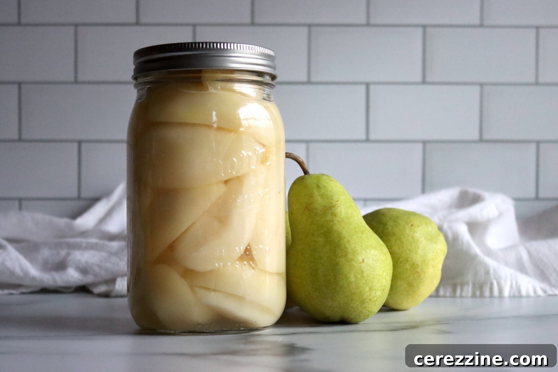 Canning Pears at Home - Freshly harvested pears on a wooden surface.