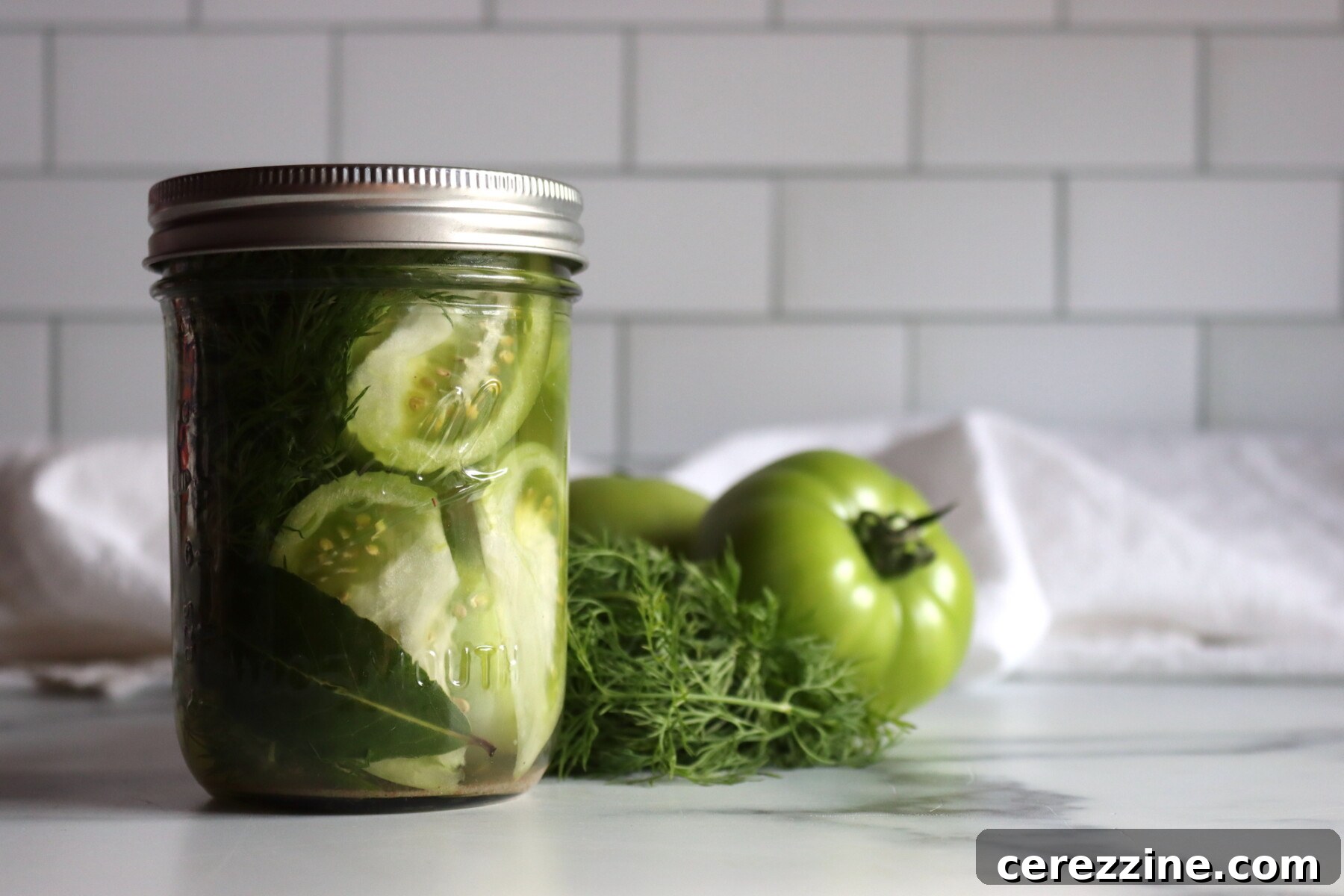 Dill Pickled Green Tomatoes Ready for Canning