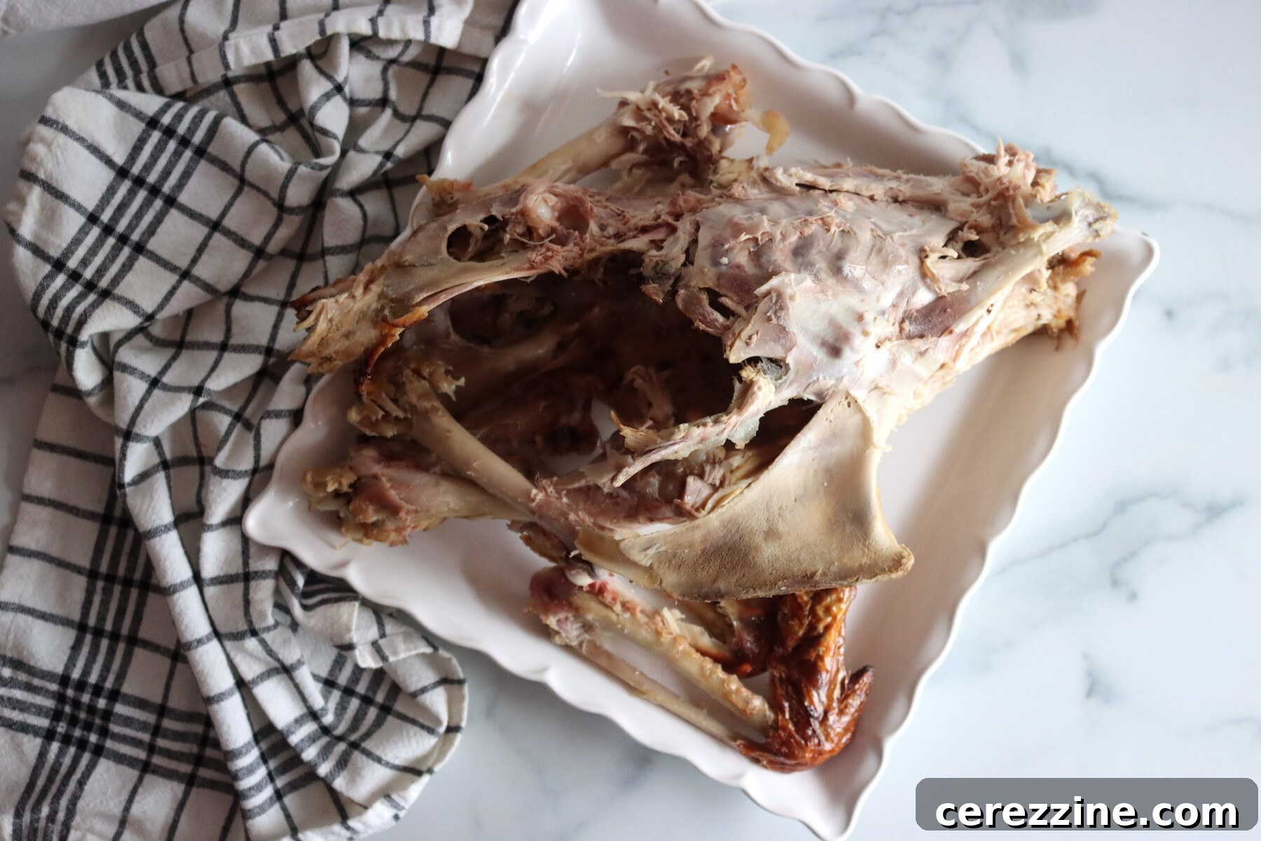 Turkey Carcass for Broth on a square plate.