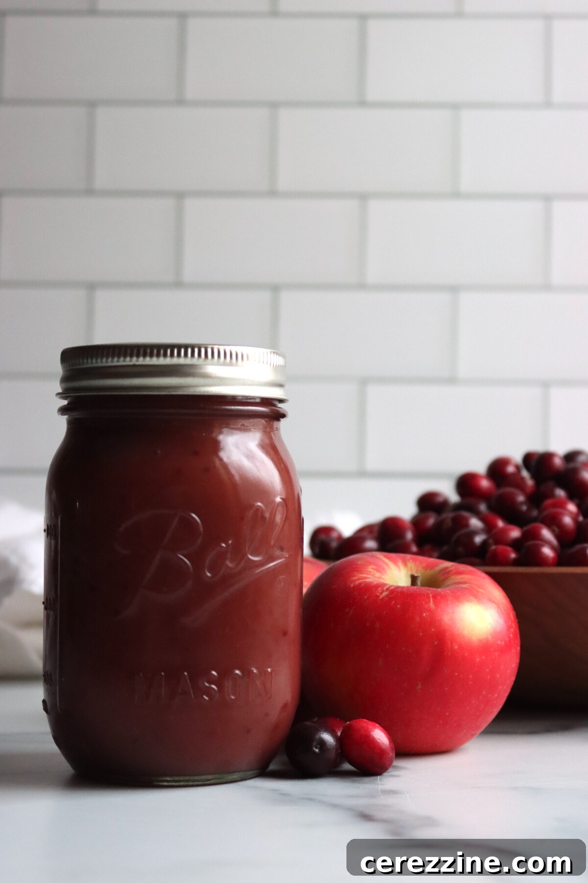 Ruby Red Cranberry Applesauce 4 Jar of Cranberry Applesauce on a wooden surface